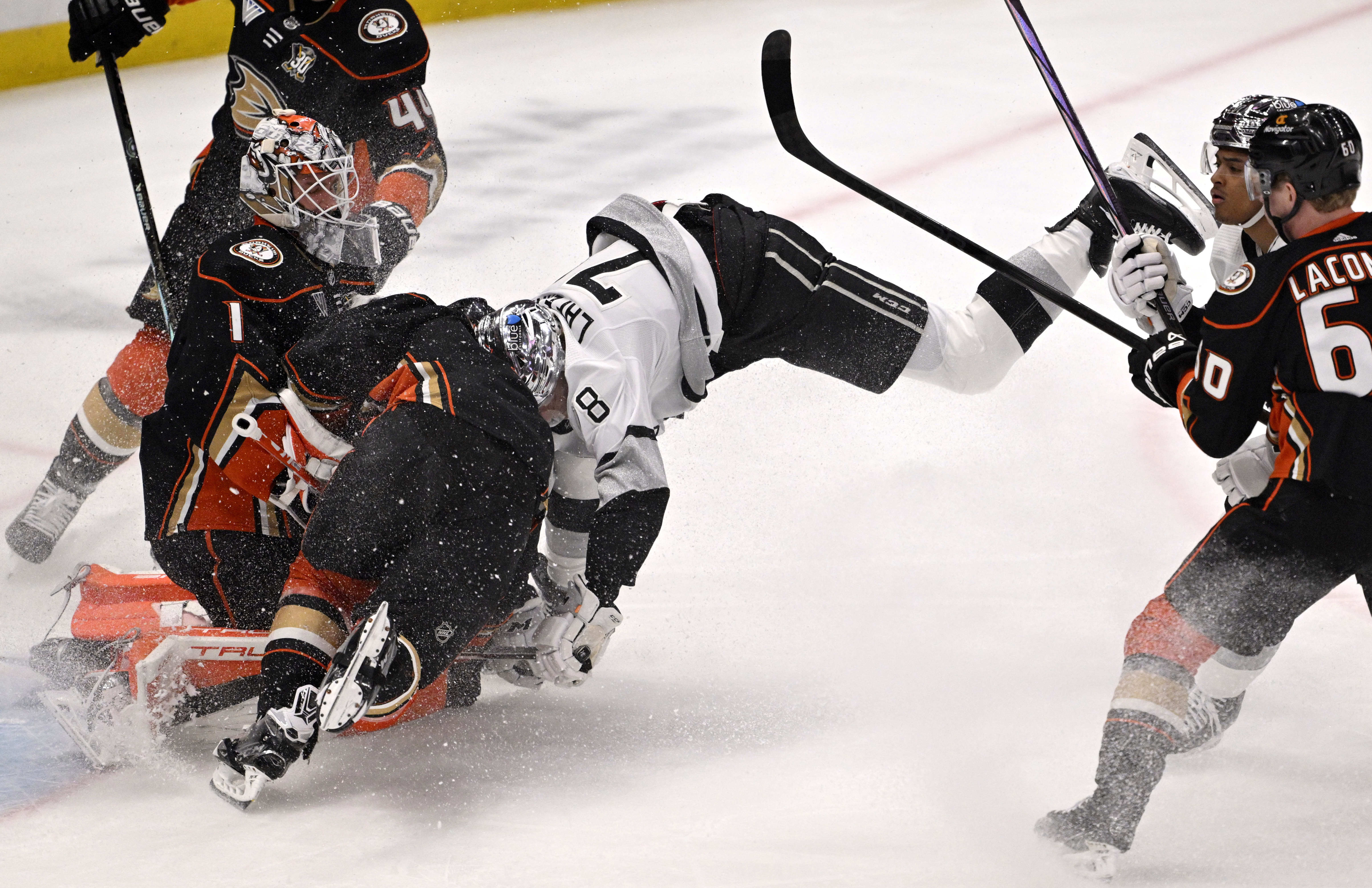 Alex Laferriere #78 of the Los Angeles Kings fights for...