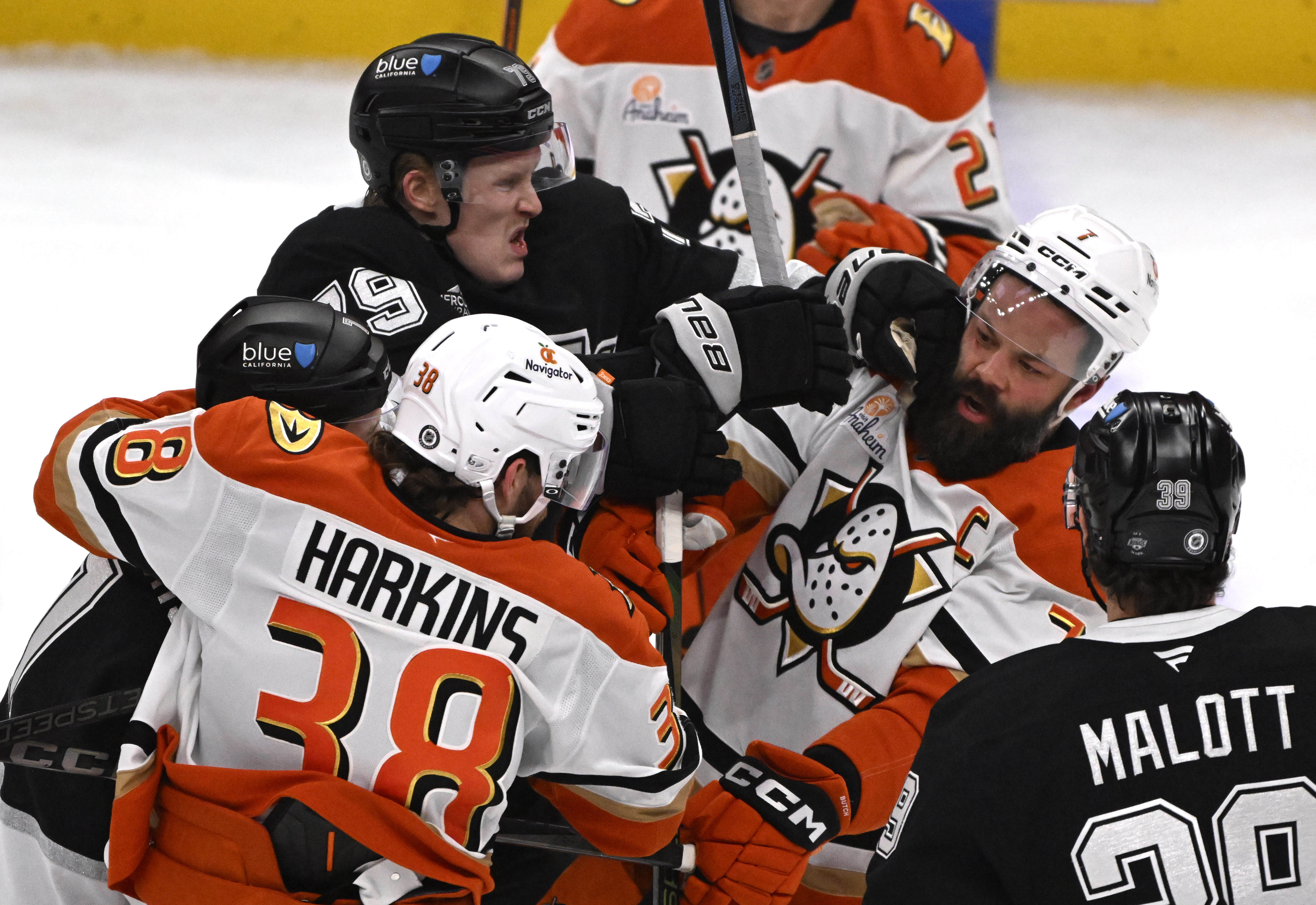 The Kings’ Samuel Helenius (79) fights with the Ducks’ Radko...