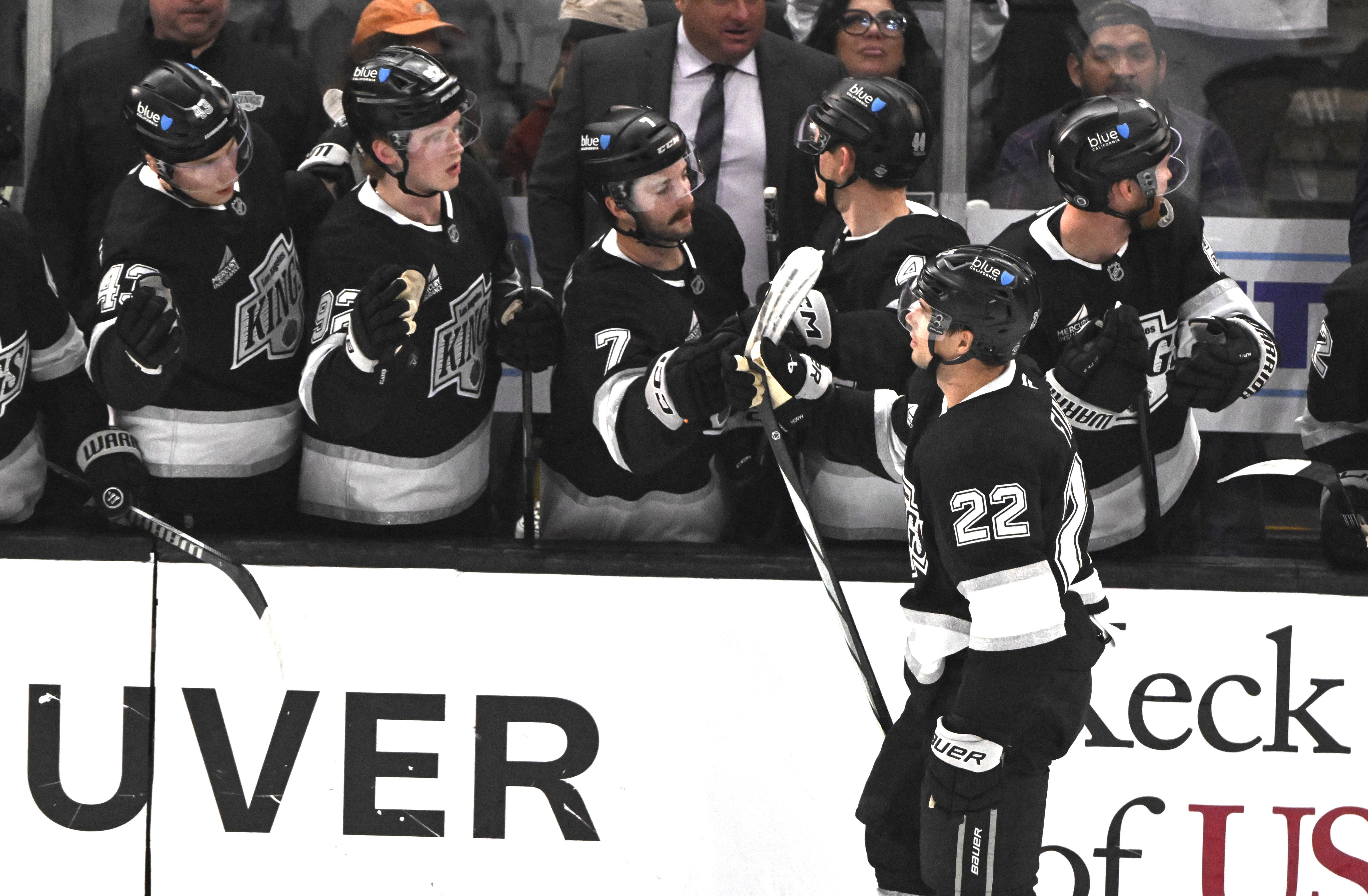 The Kings’ Kevin Fiala (22) high-fives teammates as he skates...
