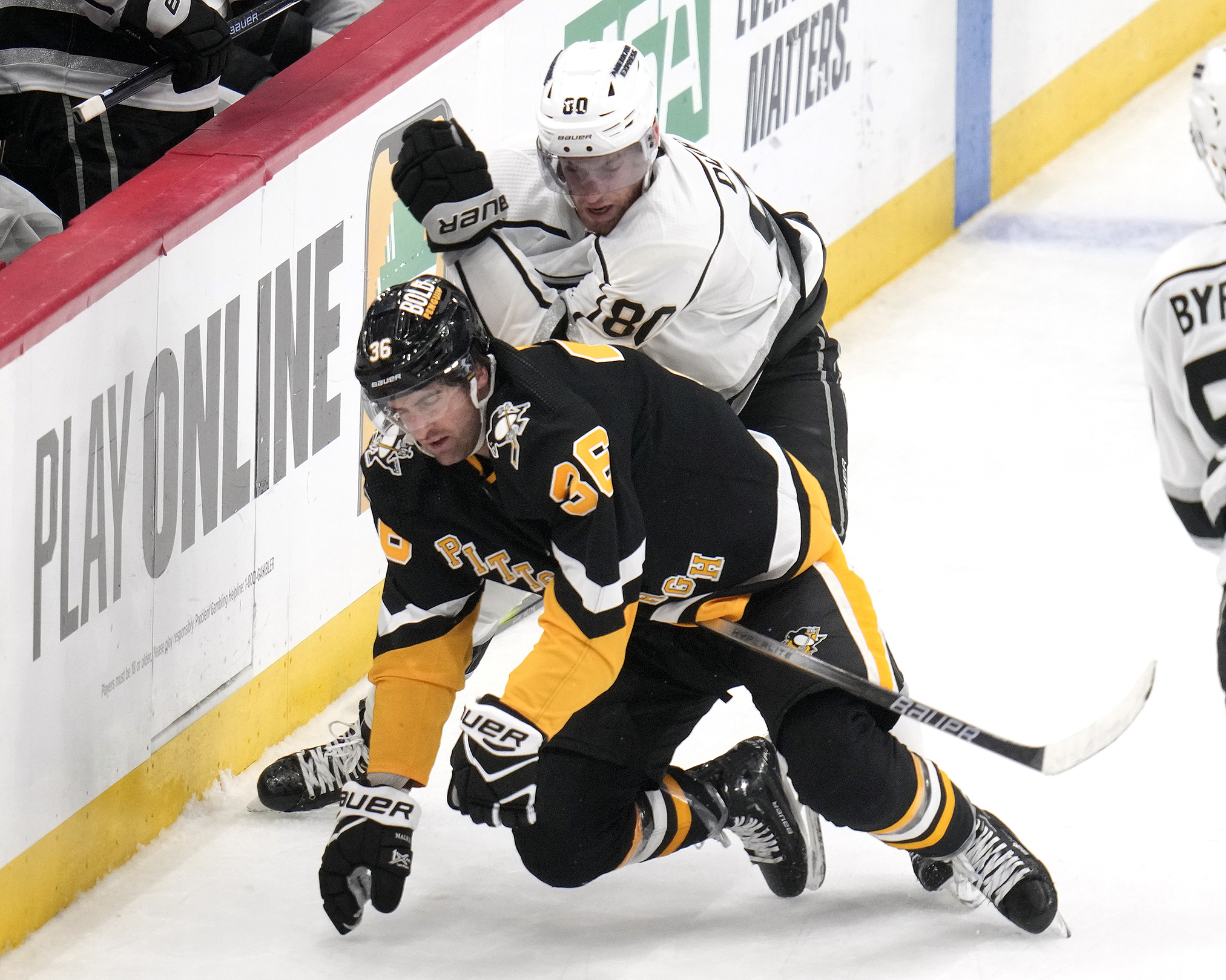 Los Angeles Kings’ Pierre-Luc Dubois (80) hooks Pittsburgh Penguins’ Colin...