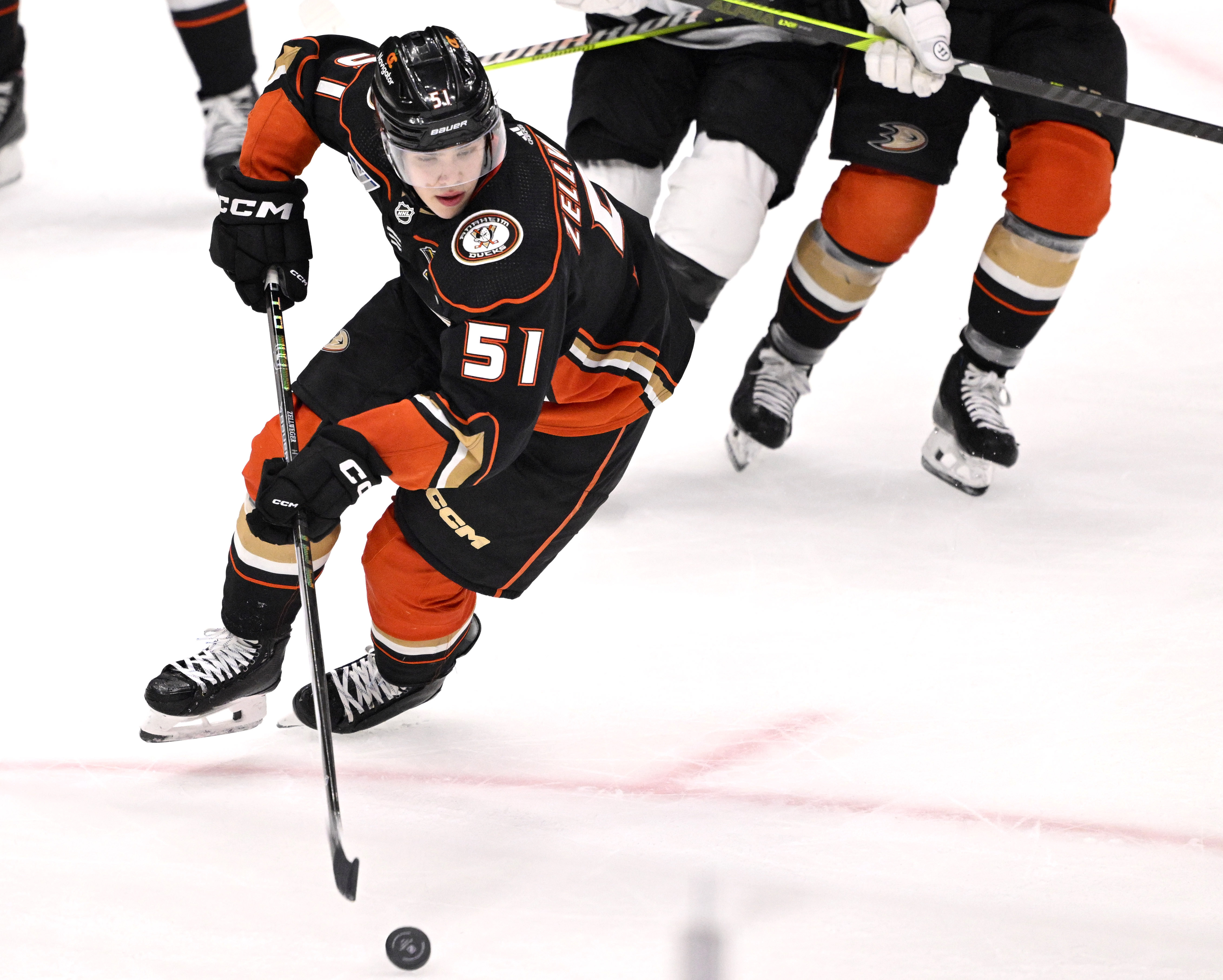 Olen Zellweger #51 of the Anaheim Ducks controls the puck...