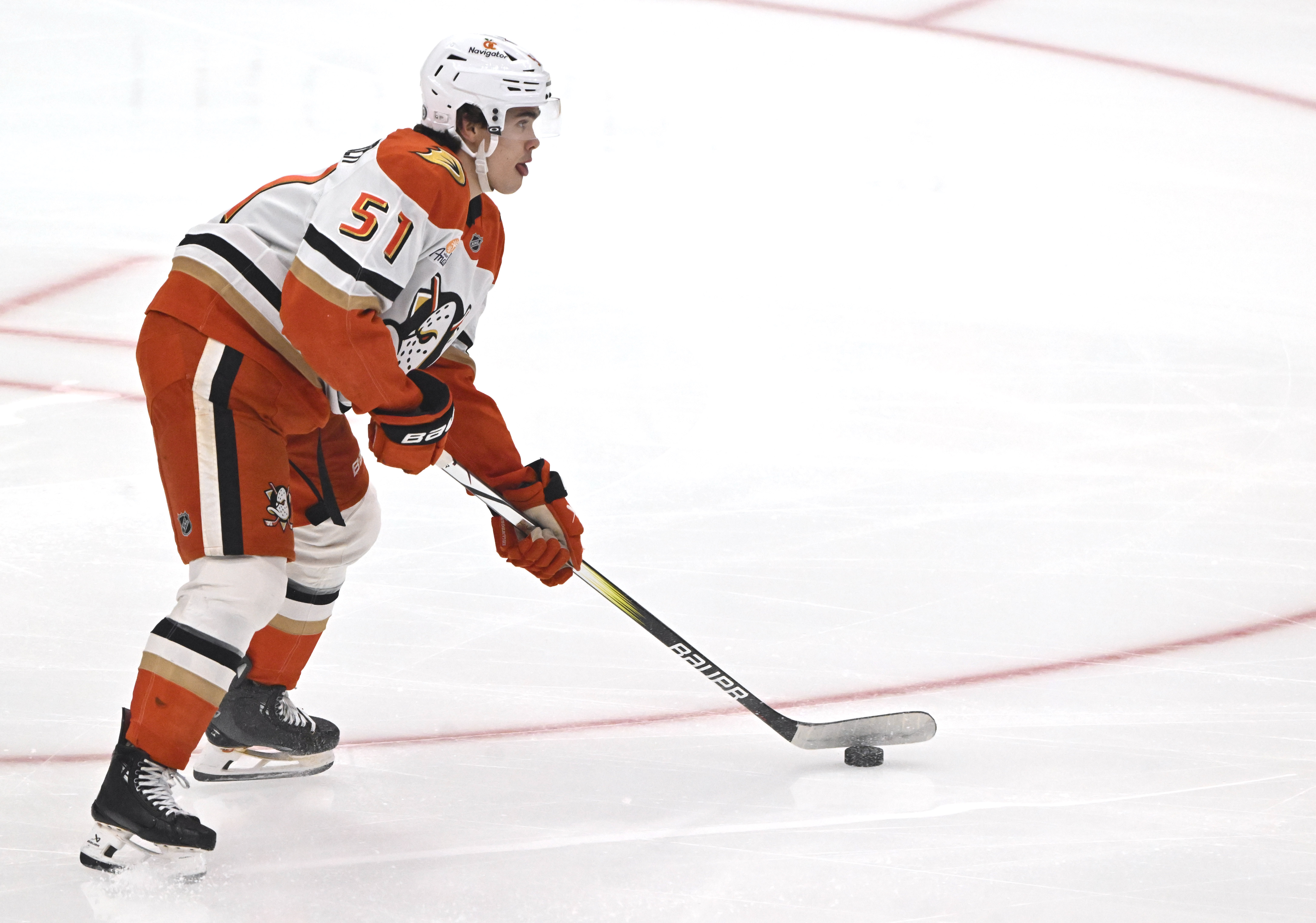 The Ducks’ Olen Zellweger controls the puck during the first...