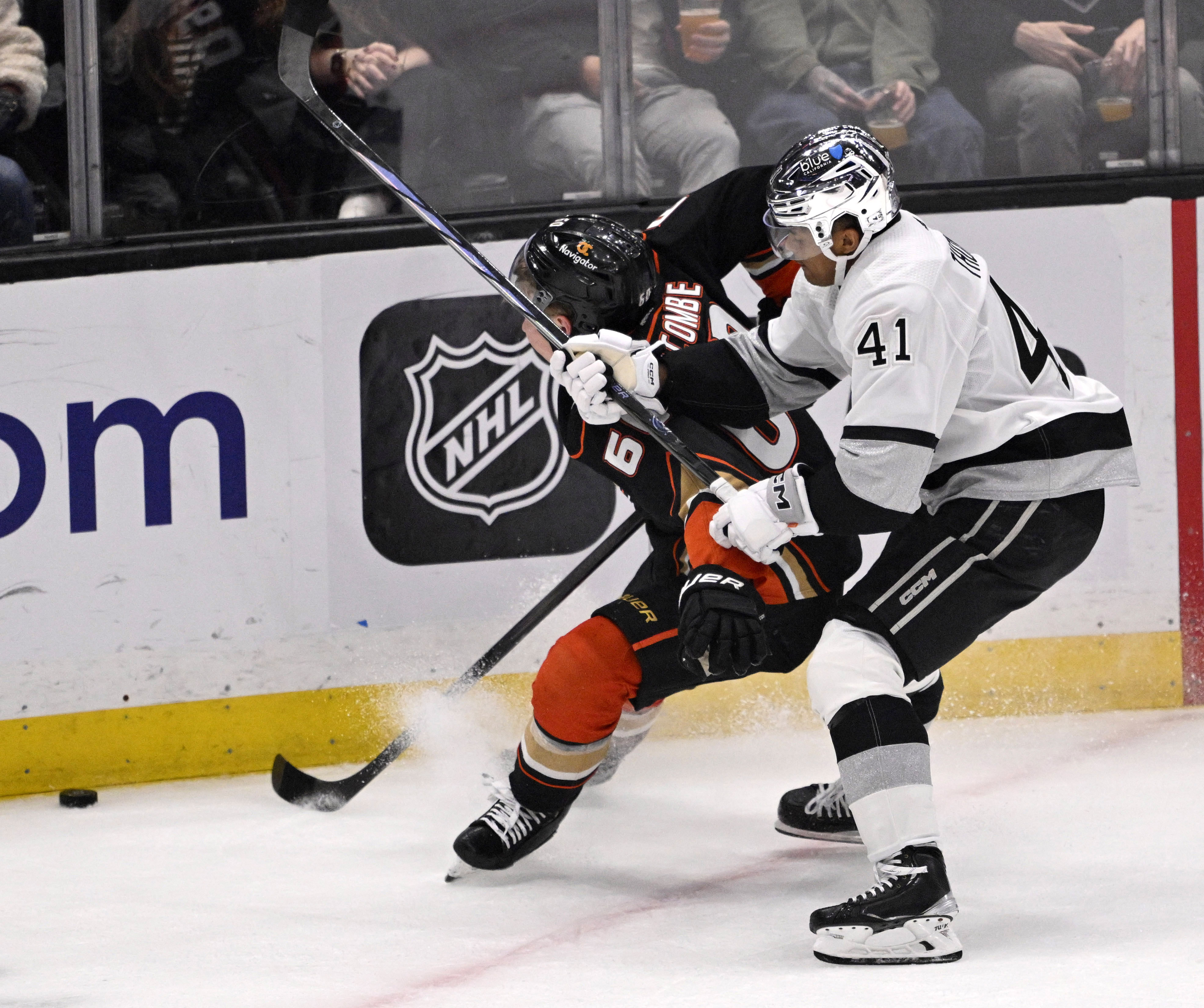 Jackson LaCombe #60 of the Anaheim Ducks takes a high...