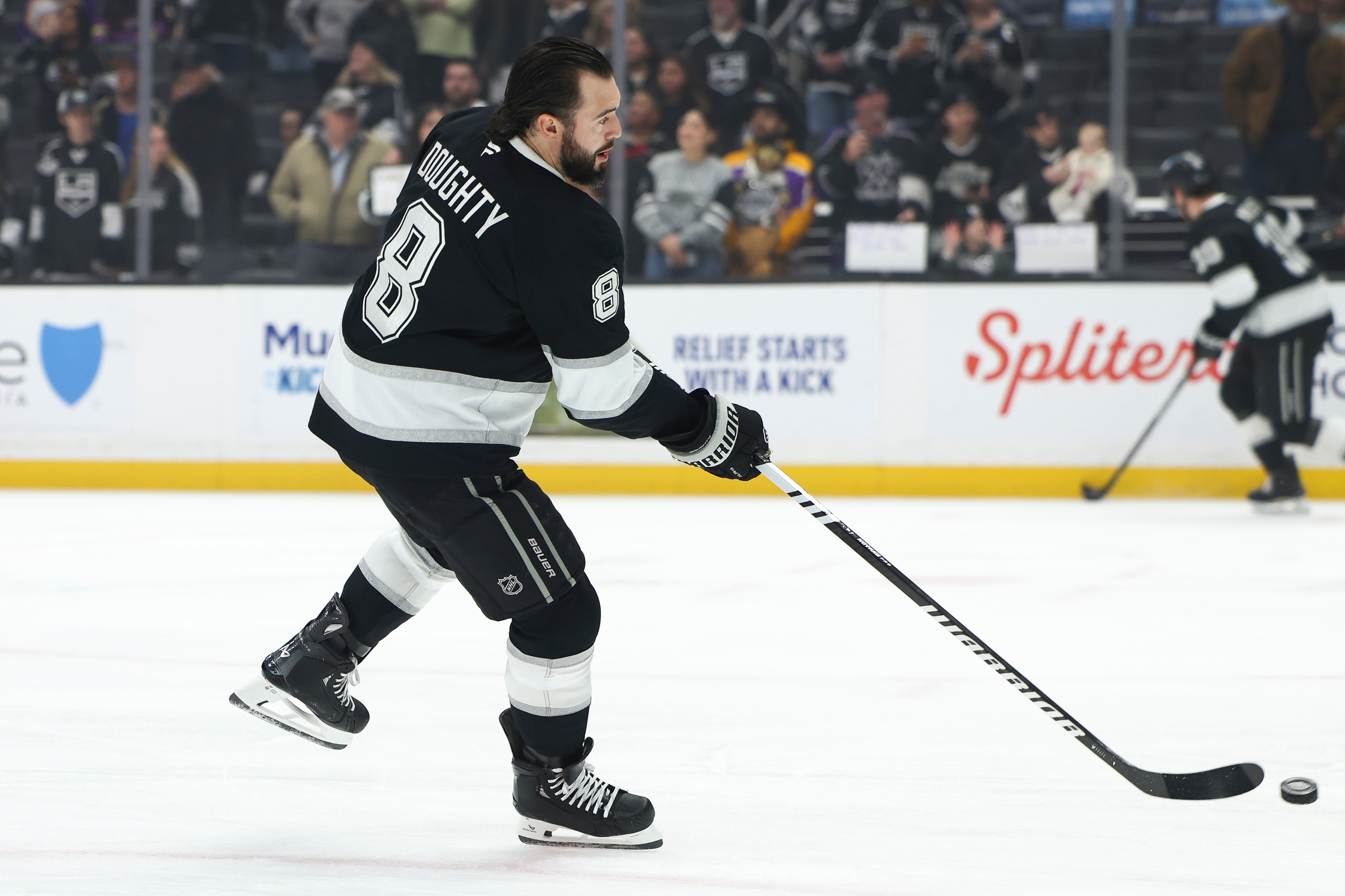 Kings defenseman Drew Doughty (8) warms up before a game...