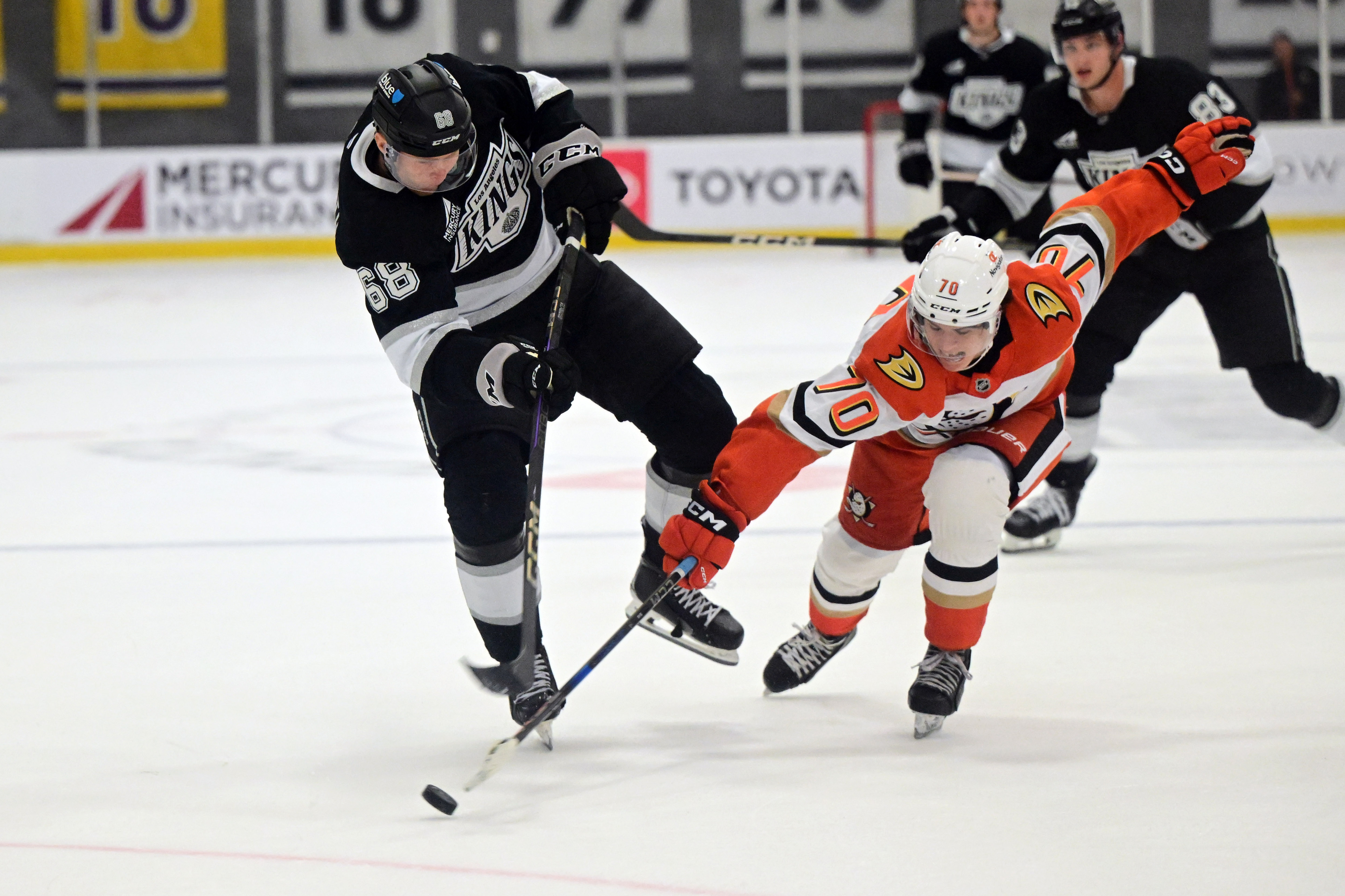The Kings’ Arvid Caderoth, left, and the Ducks’ Alexandre Blais...