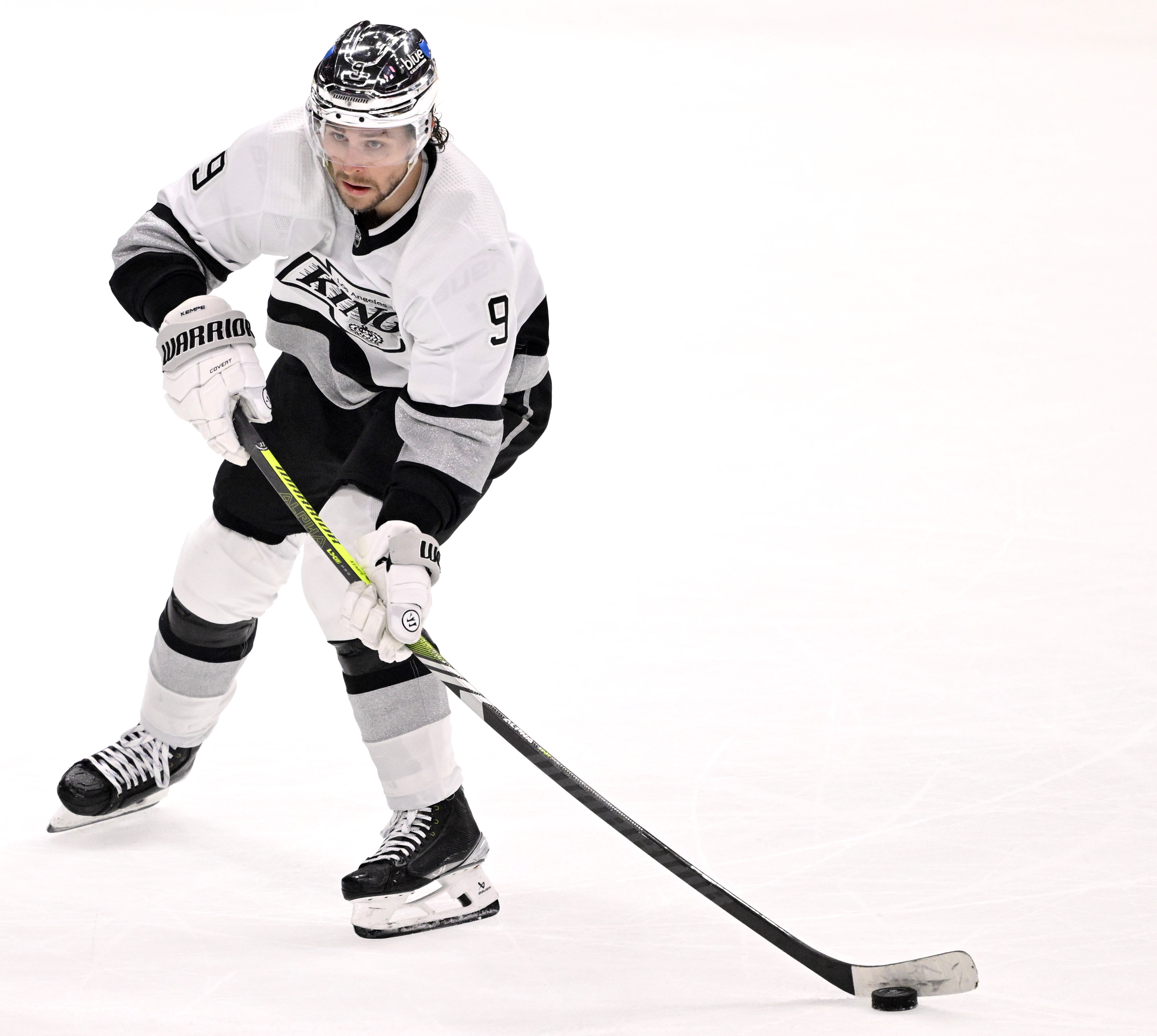 Adrian Kempe #9 of the Los Angeles Kings controls the...