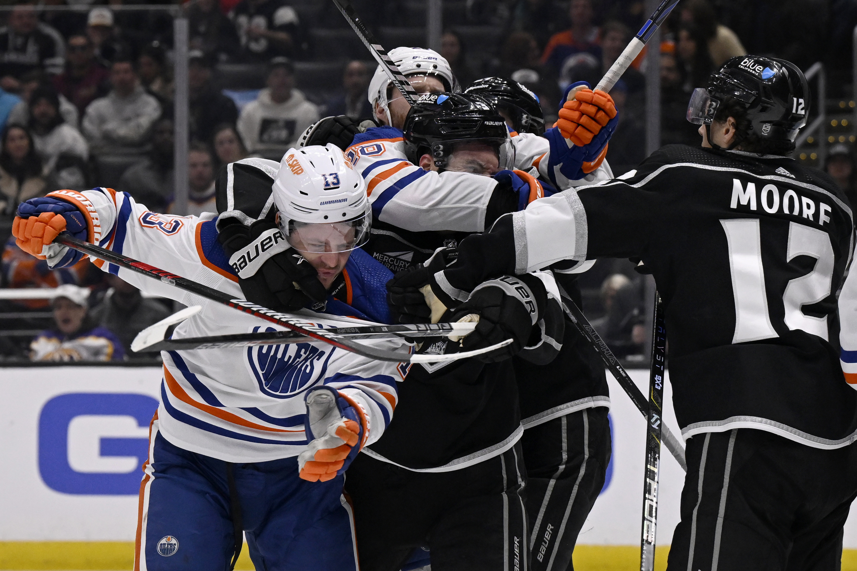Edmonton Oilers center Mattias Janmark (13) fights with Los Angeles...
