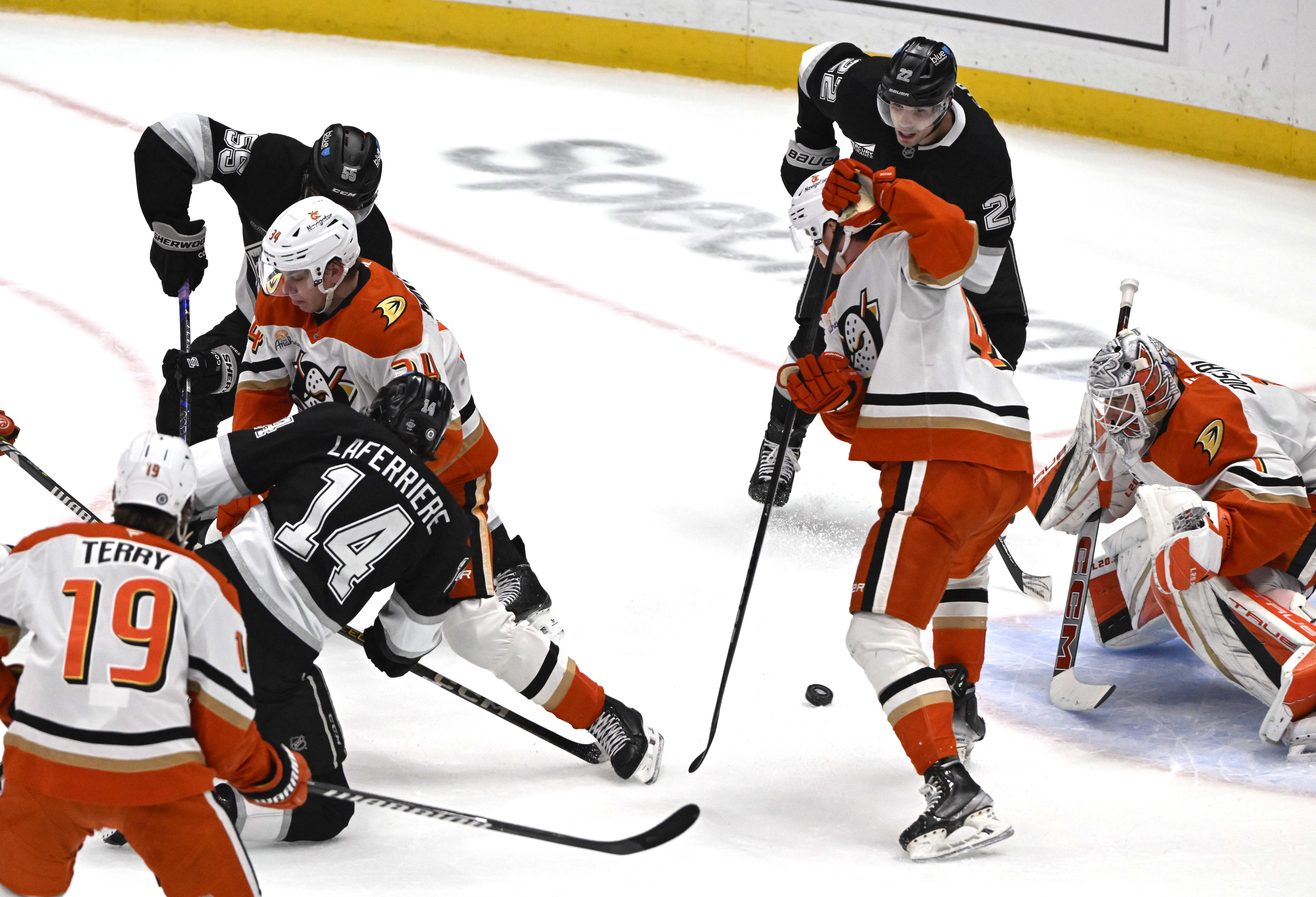 The Kings’ Alex Laferriere (14) scores past Ducks goaltender Lukas...