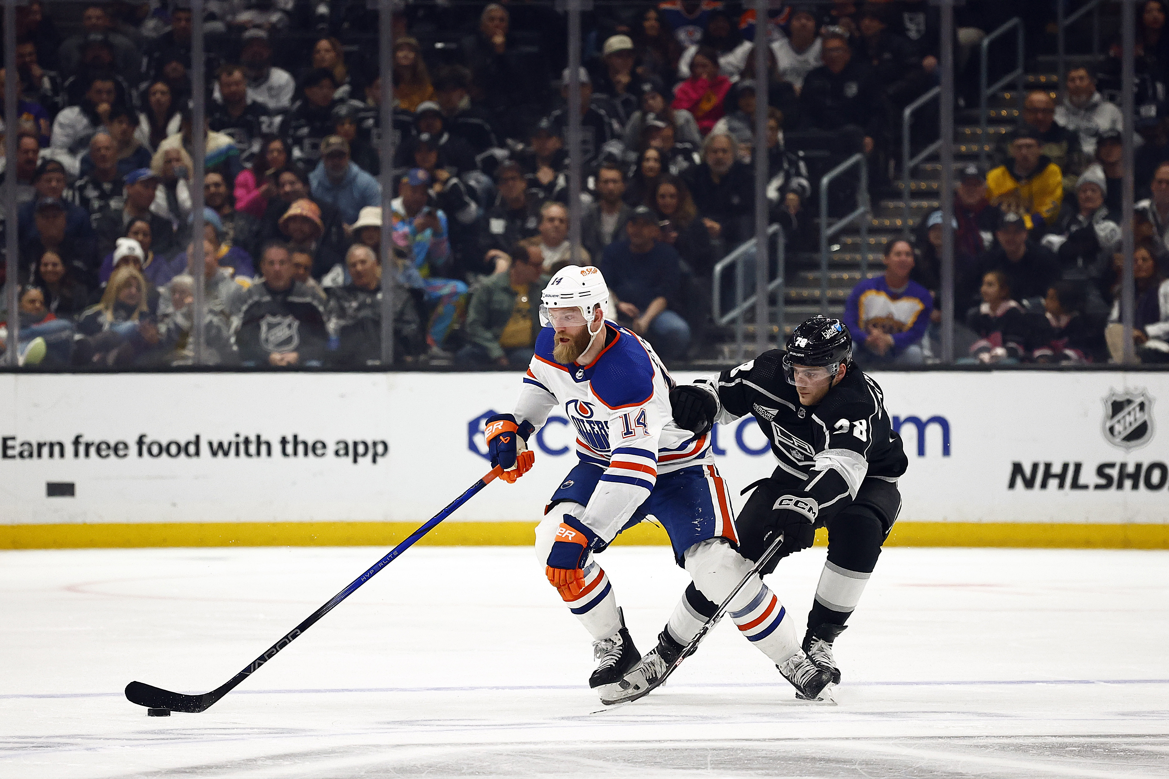 Mattias Ekholm #14 of the Edmonton Oilers skates the puck...