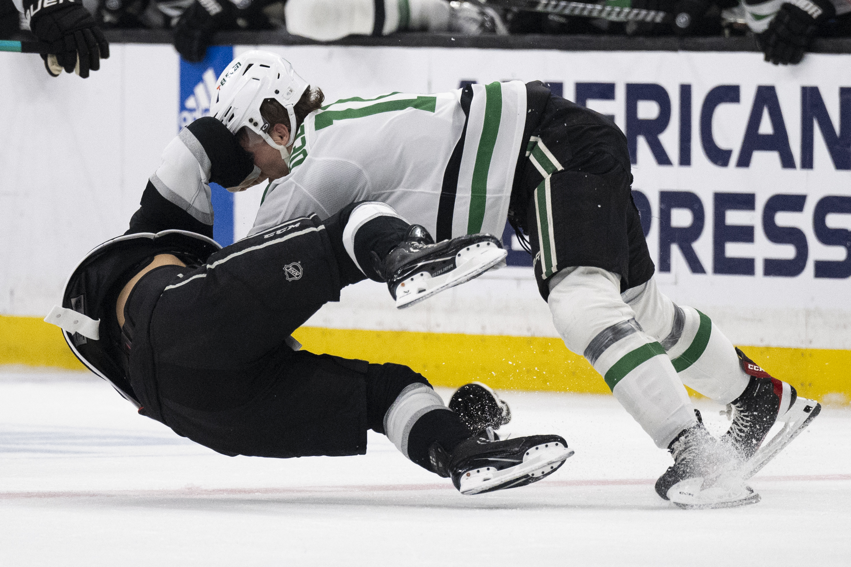Los Angeles Kings center Blake Lizotte, left, fights Dallas Stars...