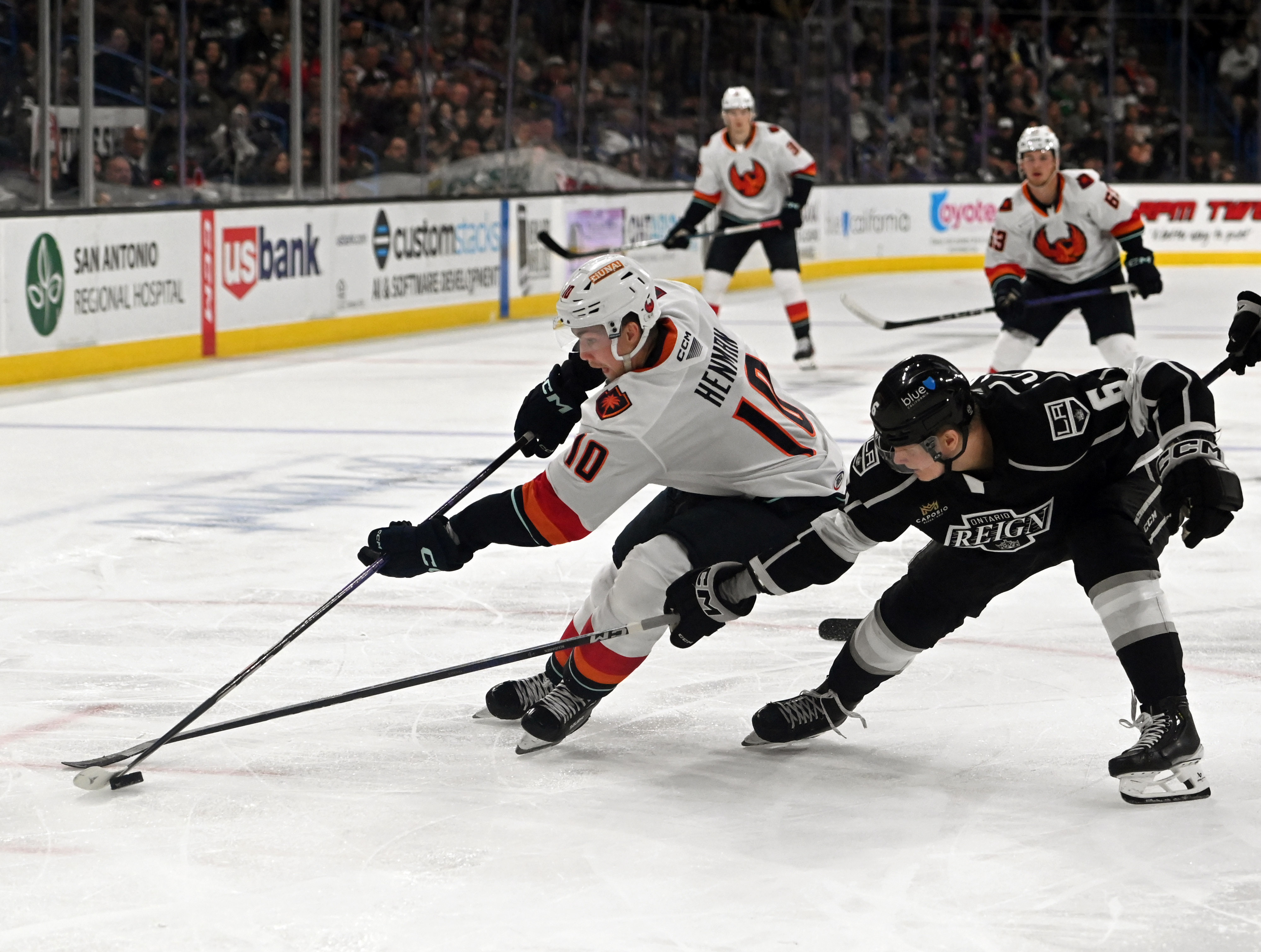 Coachella Valley Firebirds’ Luke Henman and Ontario Reign’s Kim Nousiainen...