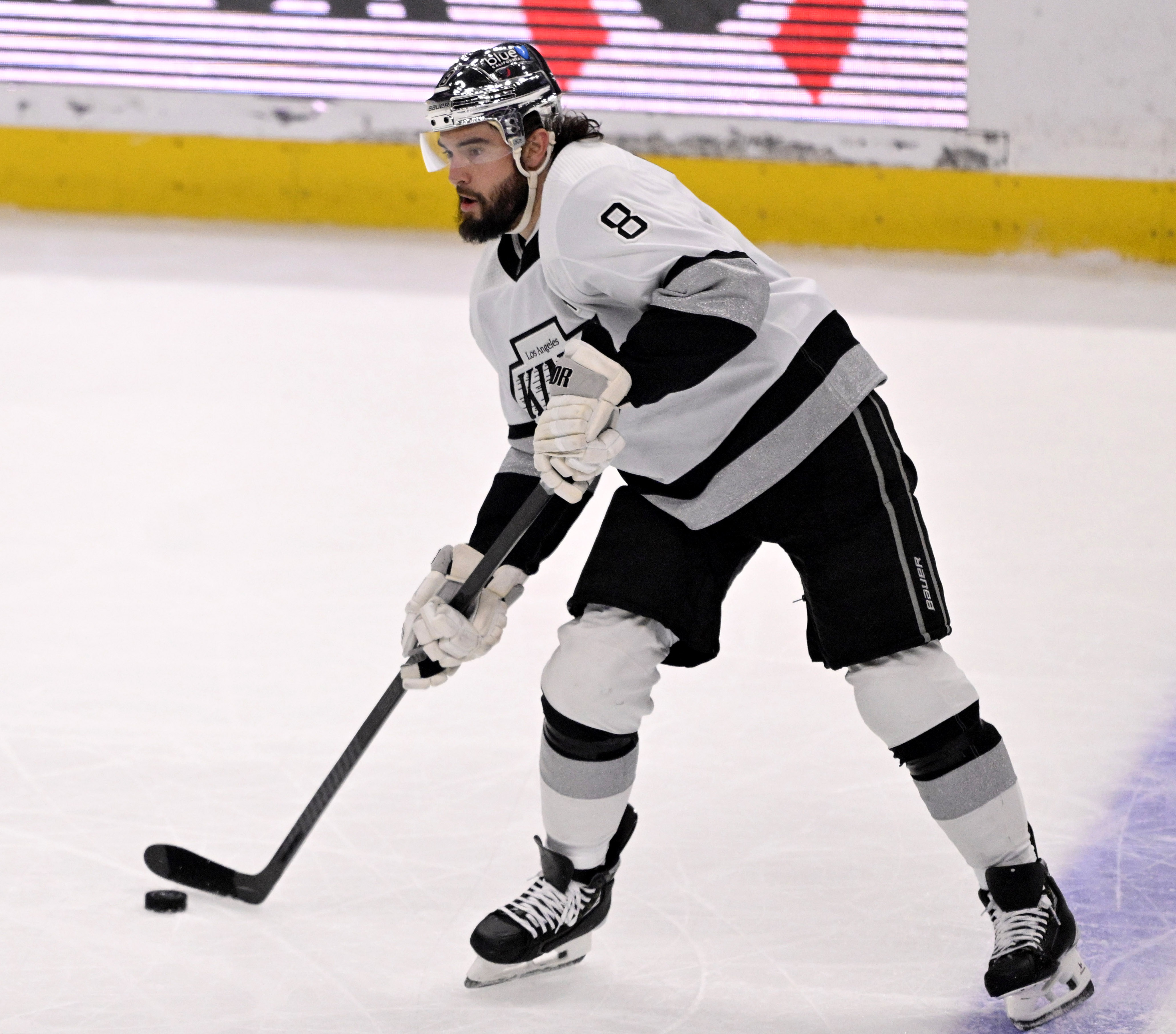 Drew Doughty #8 of the Los Angeles Kings controls the...