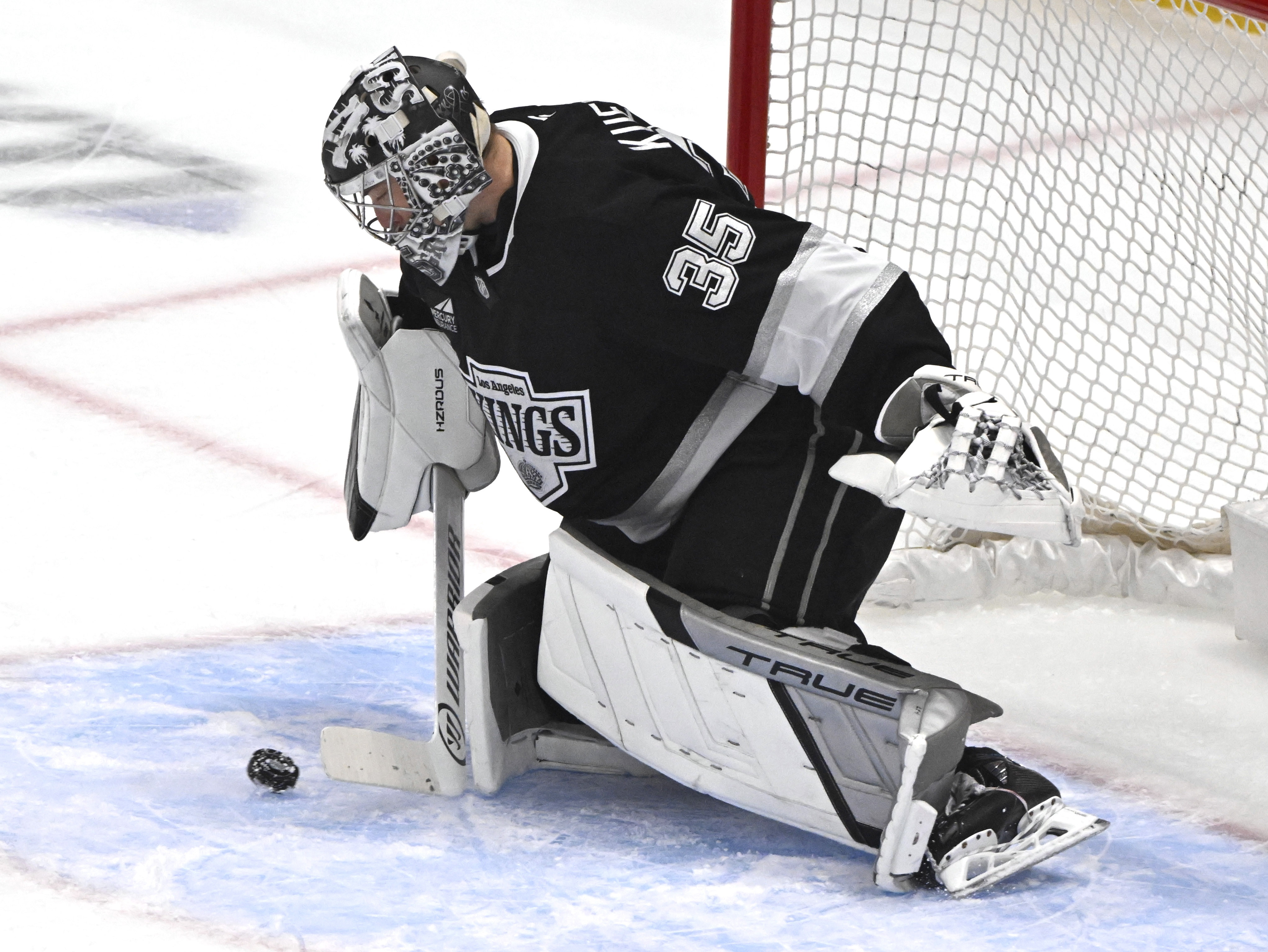 Kings goaltender Darcy Kuemper blocks a shot during the first...