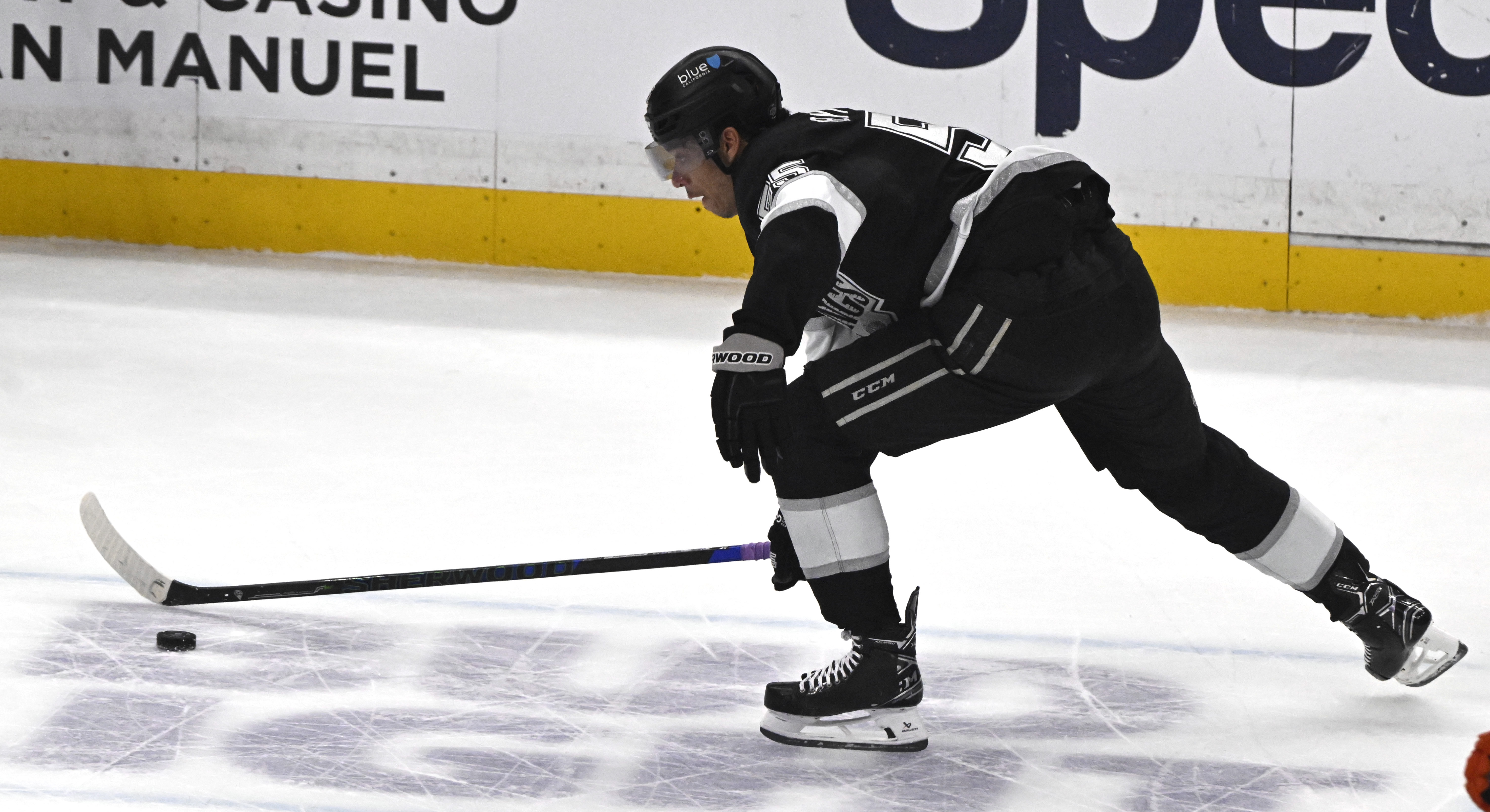 The Kings’ Quinton Byfield controls the puck during the first...
