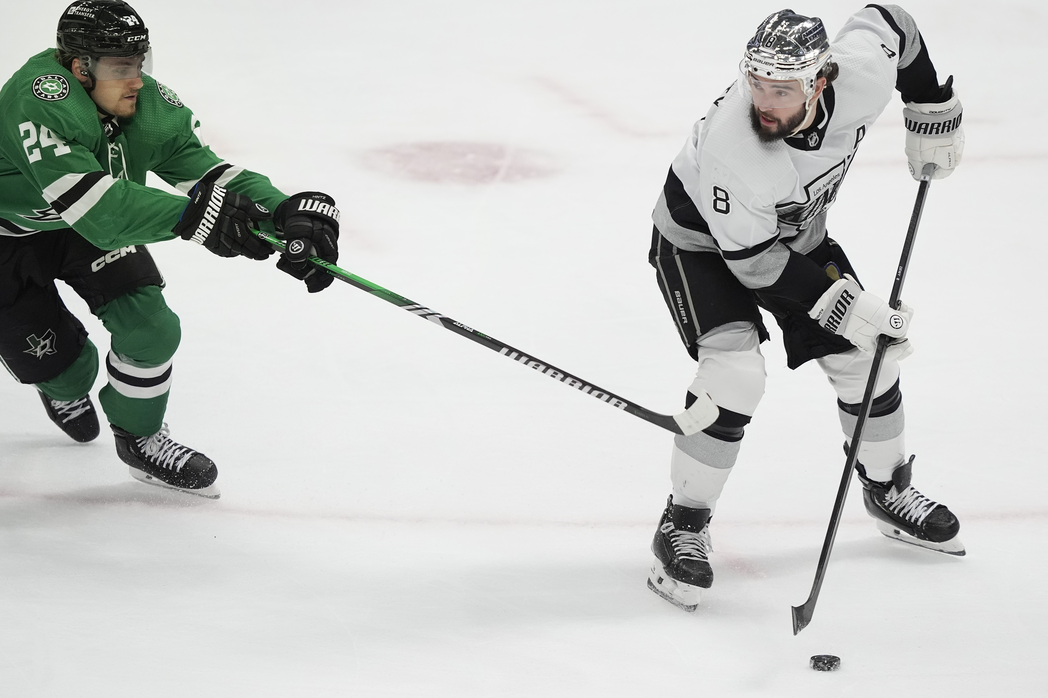 Los Angeles Kings defenseman Drew Doughty (8) tries to keep...