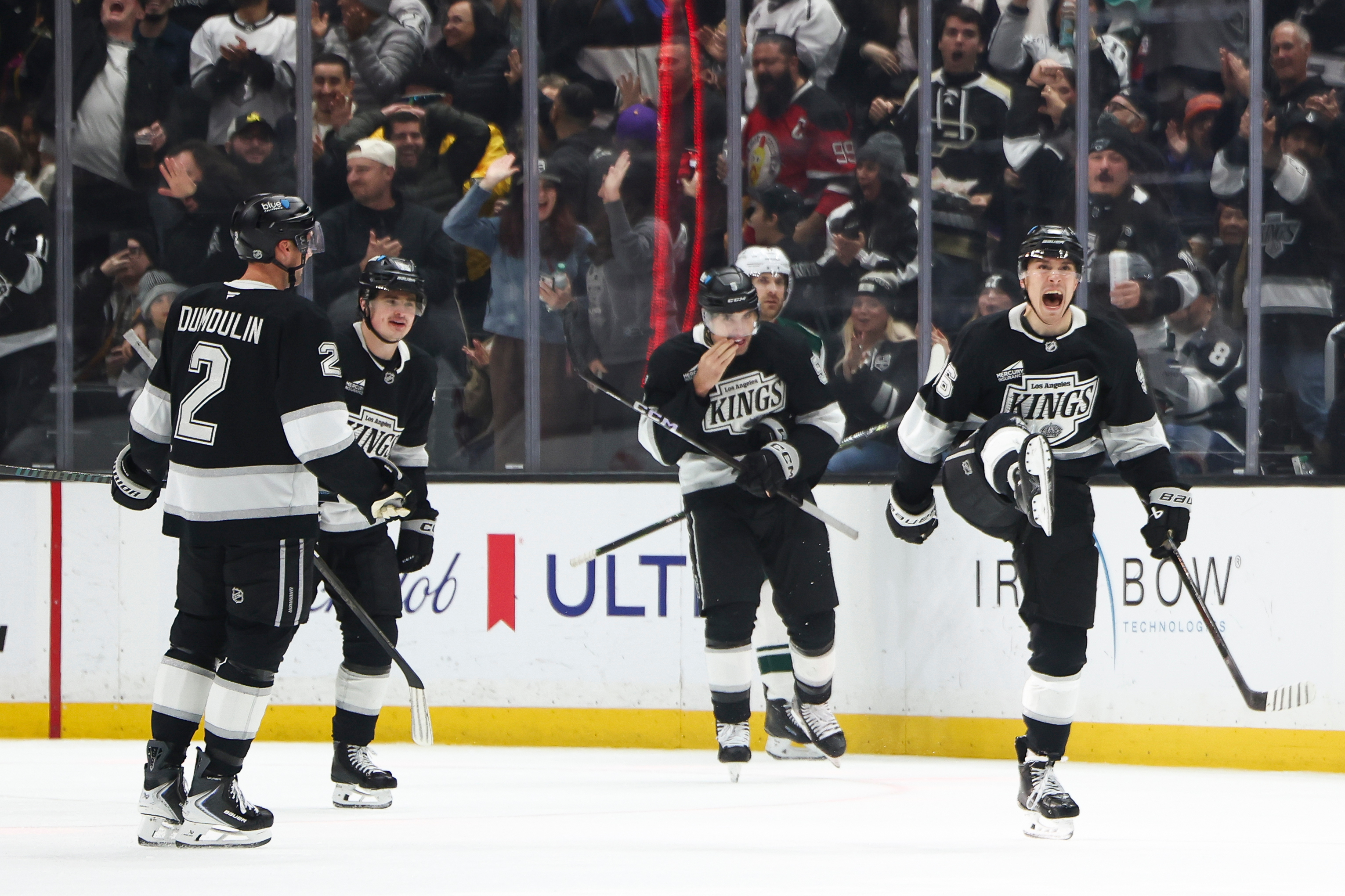 Kings left wing Andrei Kuzmenko, right, celebrates after scoring a...