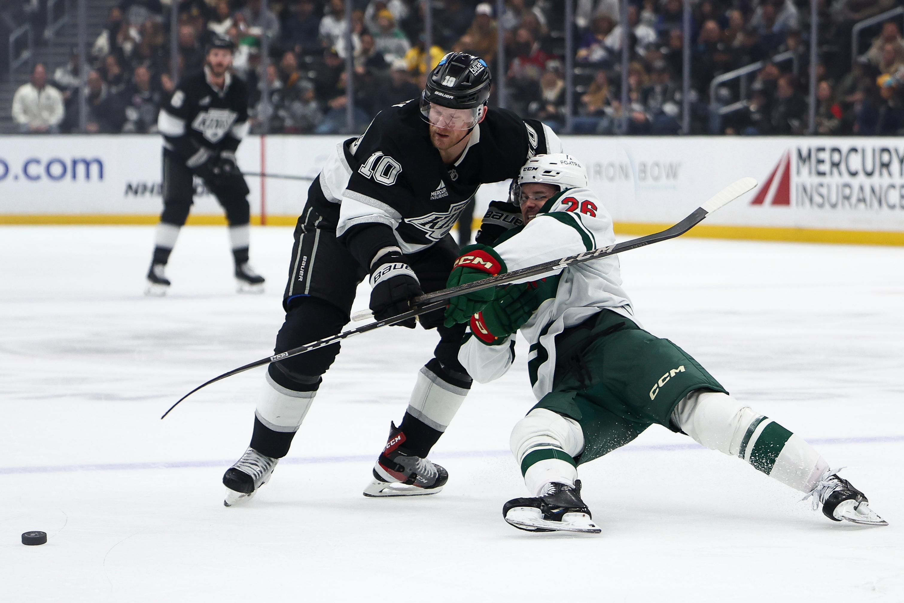 Kings right wing Corey Perry (10) and Minnesota Wild defenseman...