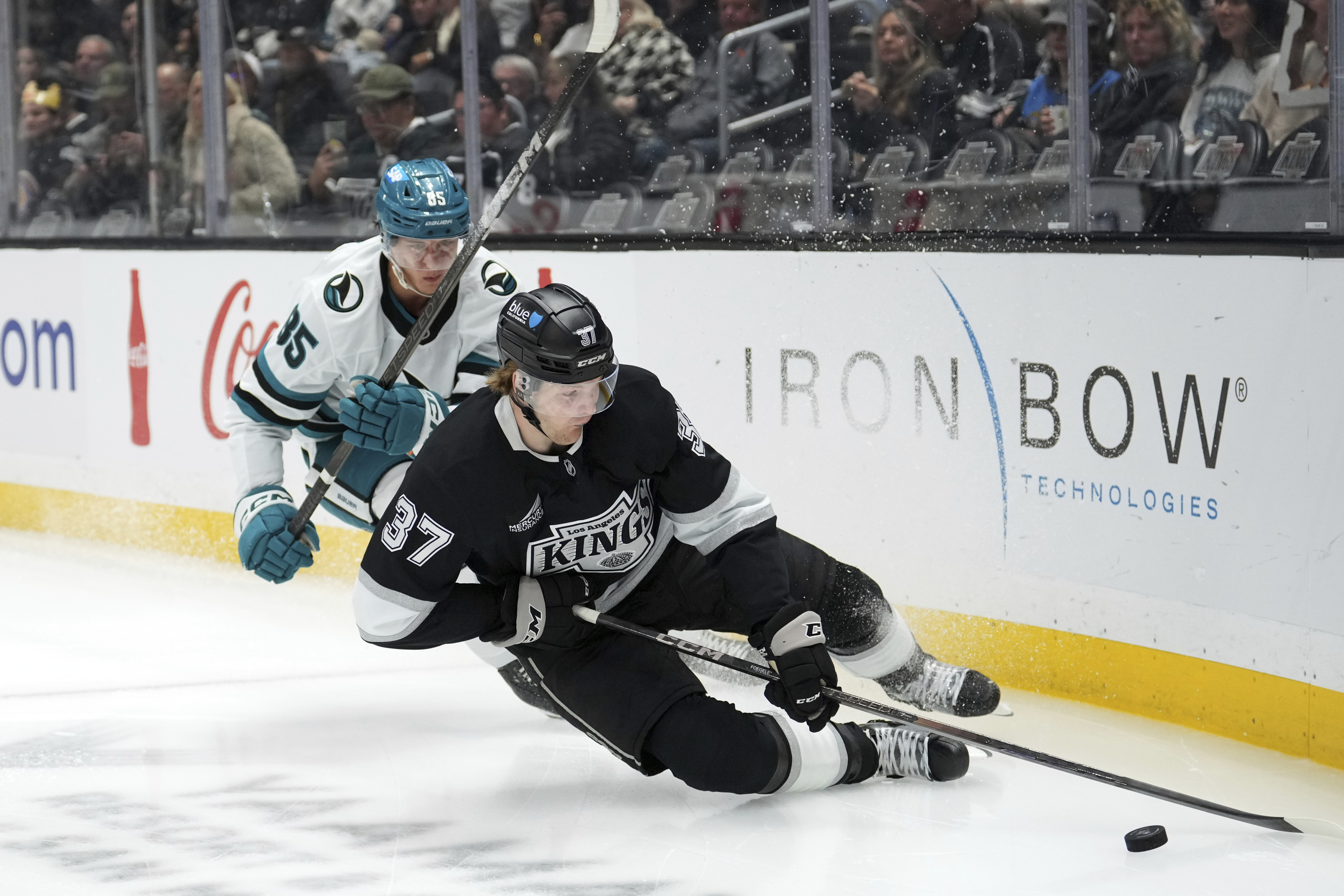 San Jose Sharks defenseman Shakir Mukhamadullin, left, and Kings left...