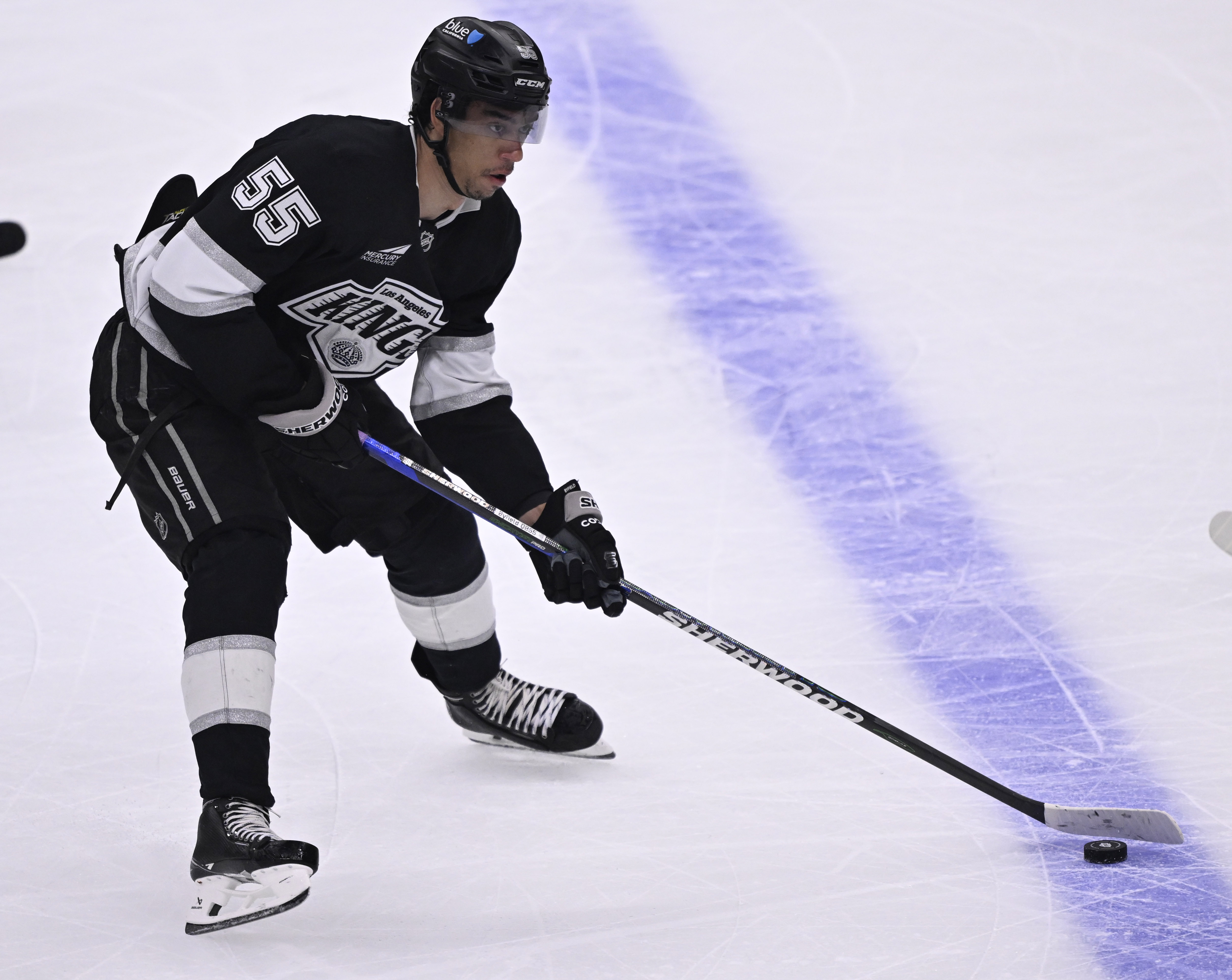 Kings right wing Quinton Byfield contols the puck during the...