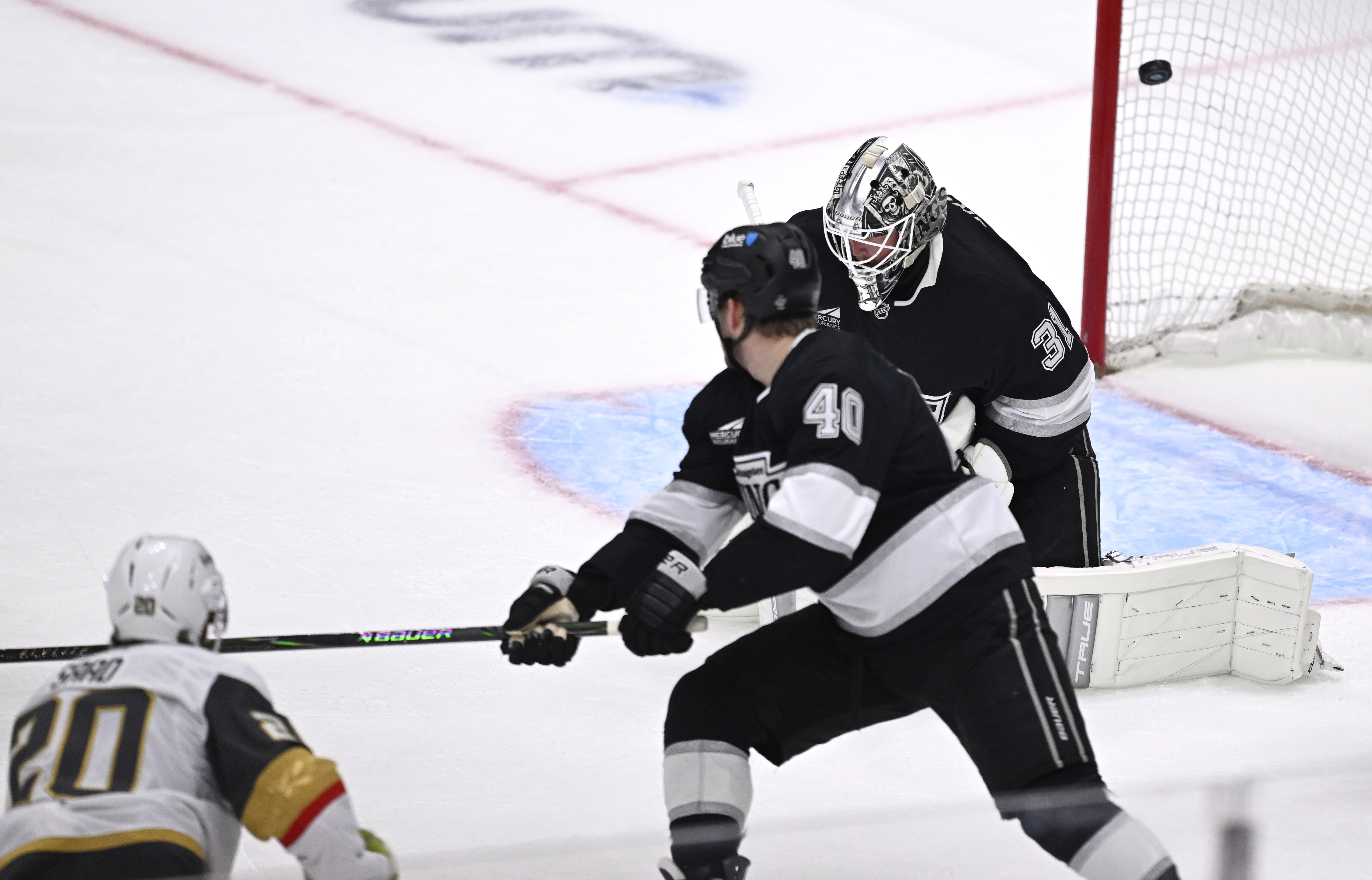 Vegas Golden Knights left wing Brandon Saad, bottom left, scores...