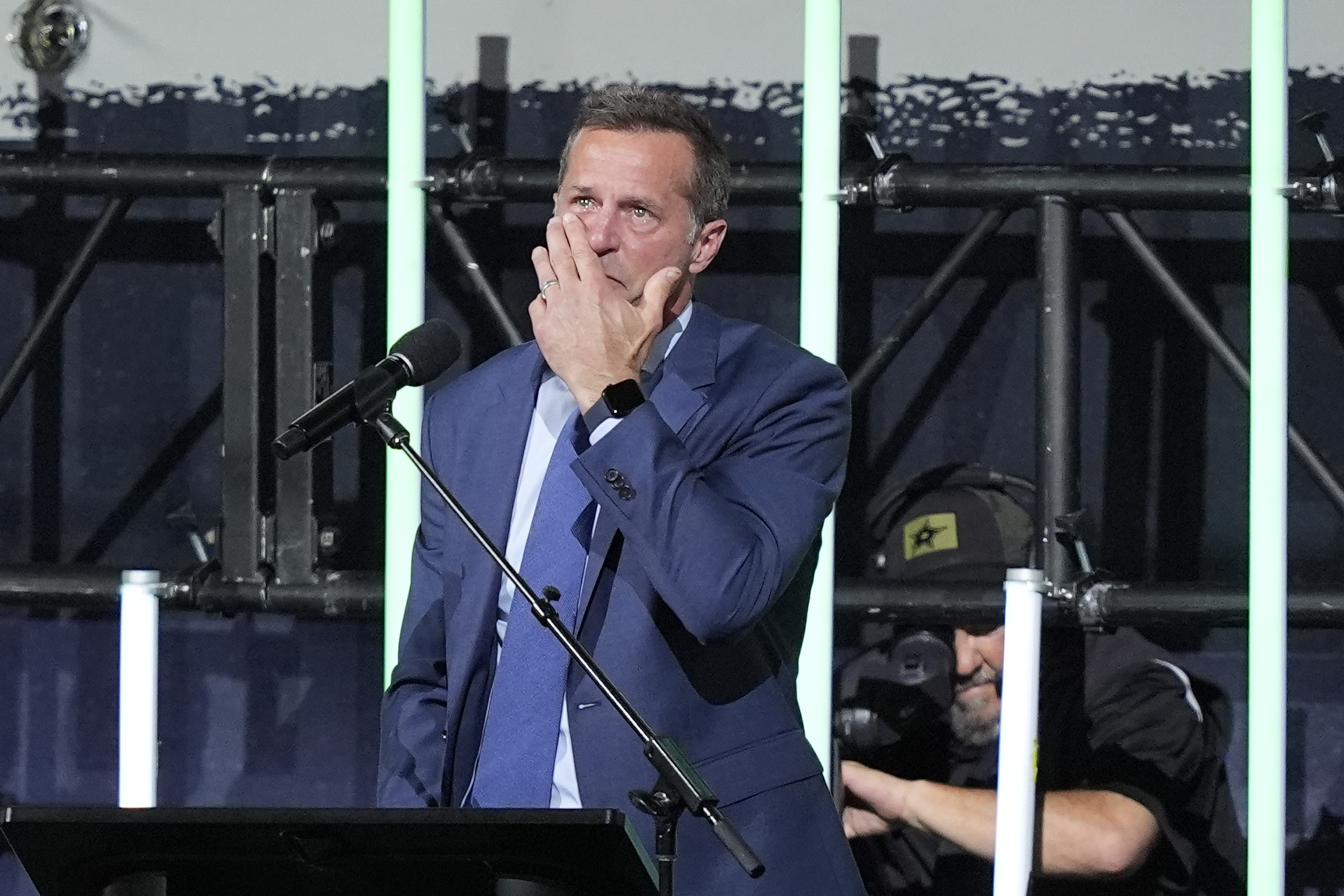 Former Dallas Stars player Mike Modano reacts as he speaks...