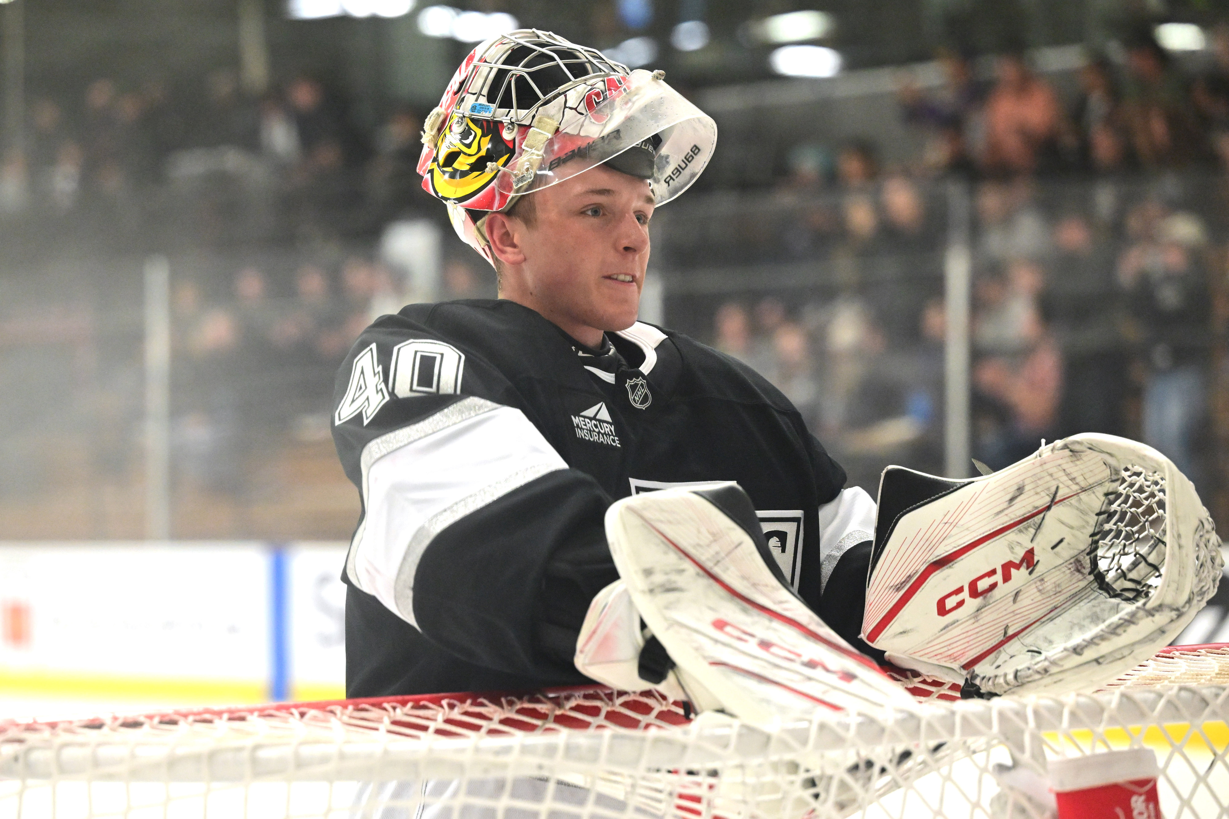 Kings goaltender Carter George looks on during a pause in...