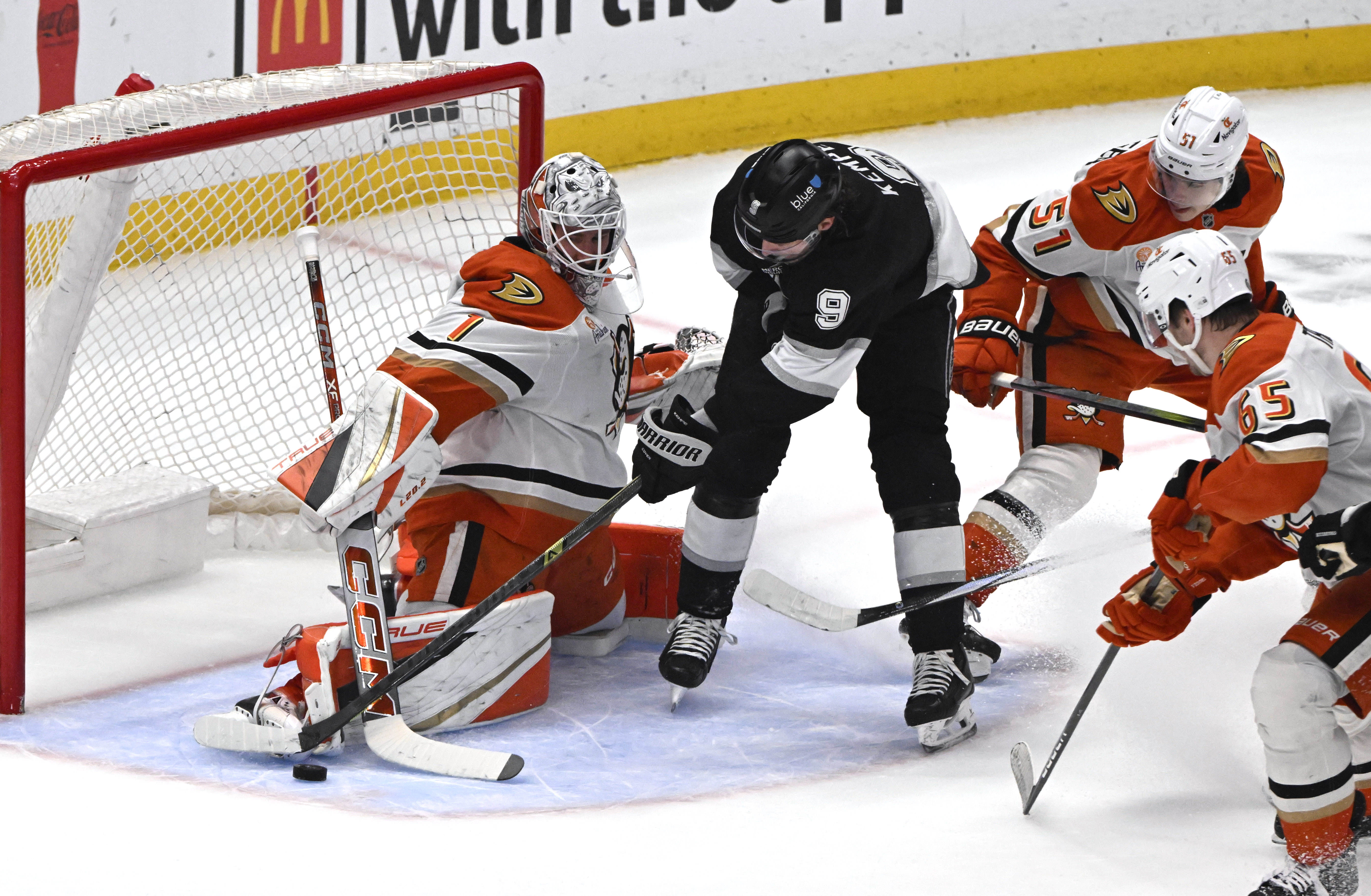 The Kings’ Adrian Kempe (9) takes a shot as Ducks...