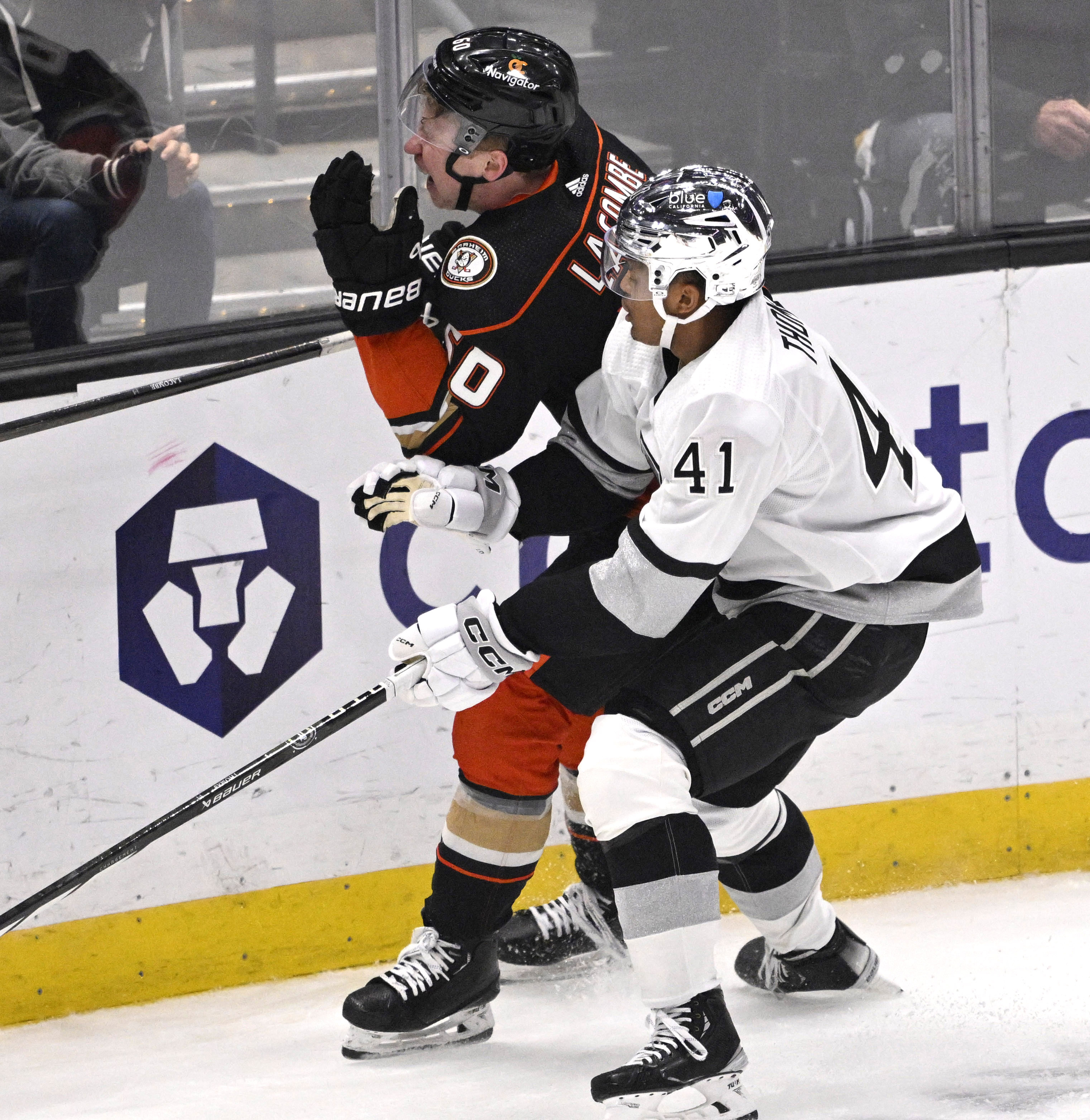 Jackson LaCombe #60 of the Anaheim Ducks takes a high...