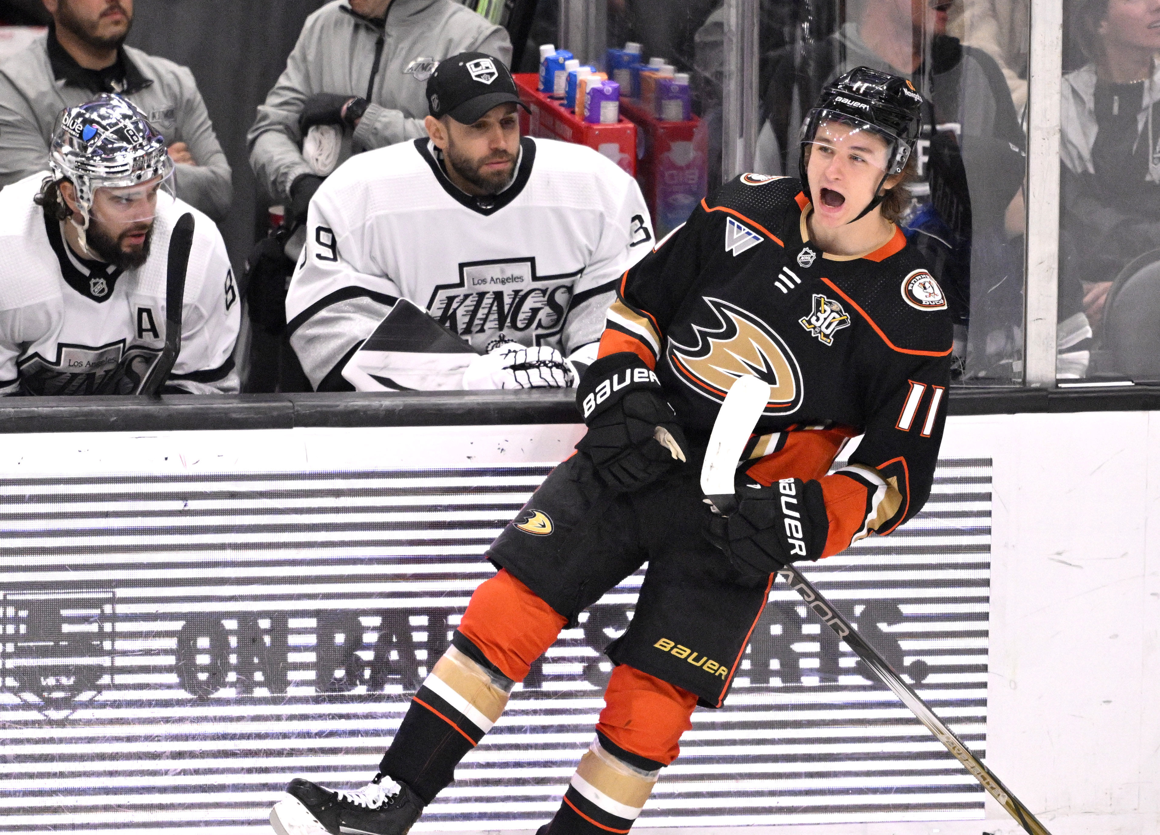 Trevor Zegras #11 of the Anaheim Ducks reacts after scoring...