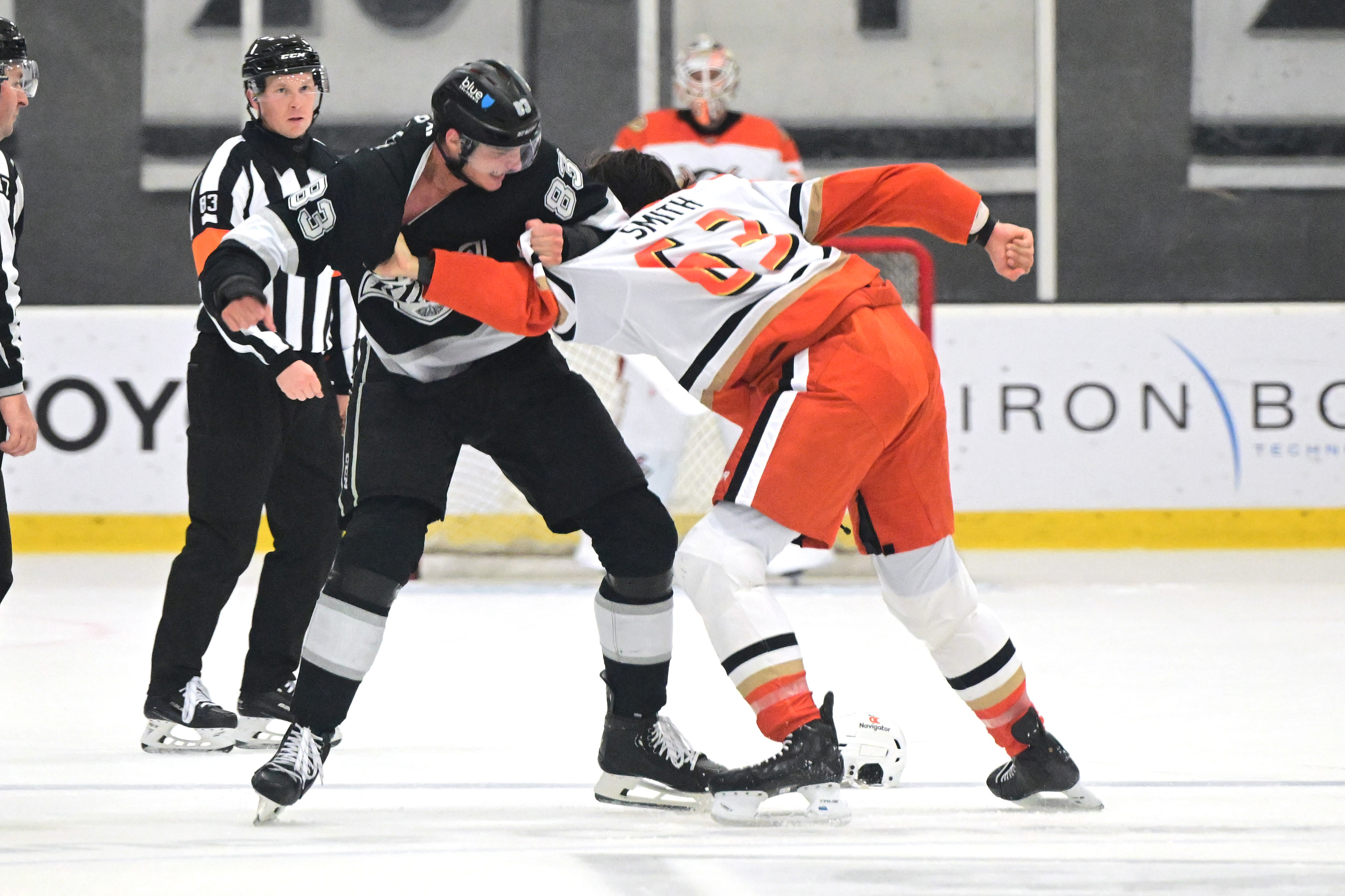 The Ducks’ Konnor Smith, right, and the Kings’ John Parker-Jones...