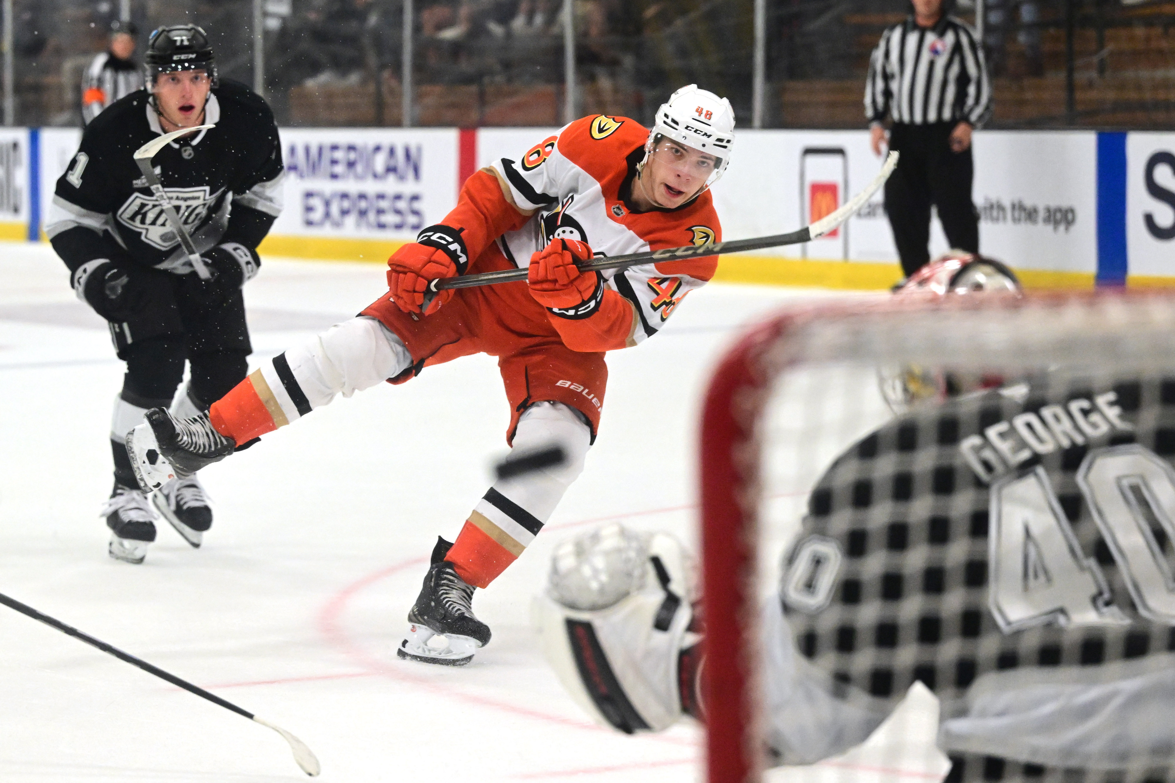 The Ducks’ Nico Myatovic (48) shoots the puck as Kings...