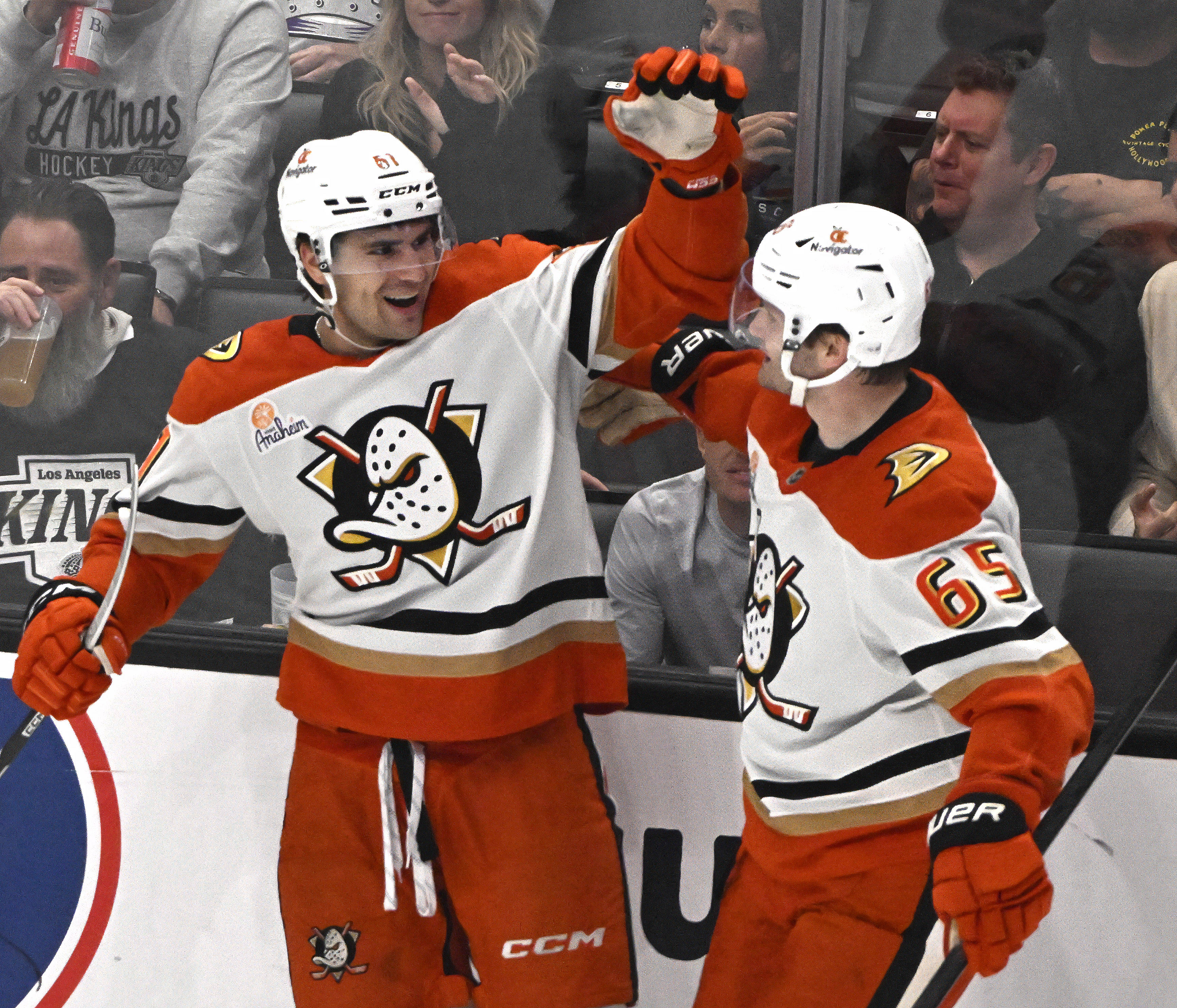 Ducks rookie Cutter Gauthier, left, celebrates with teammate Jacob Trouba...