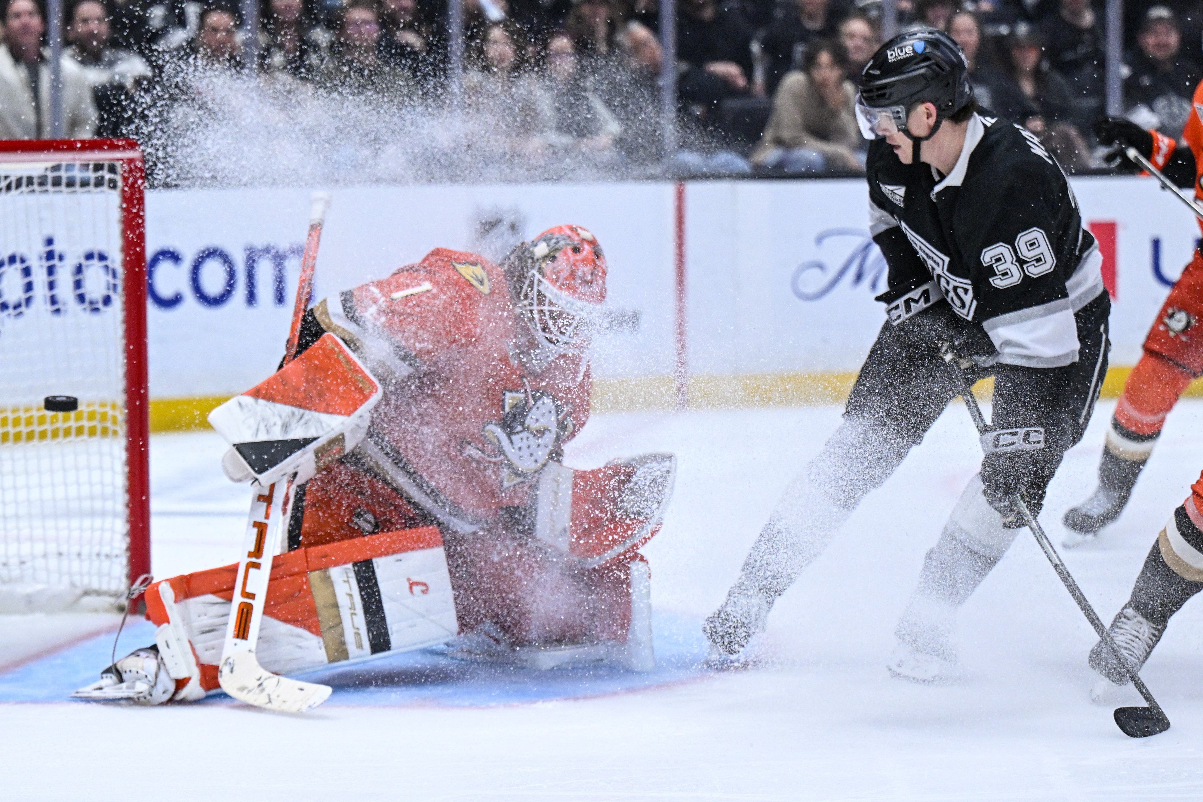 The Kings’ Jeff Malottâs (39) has his shot deflected by...
