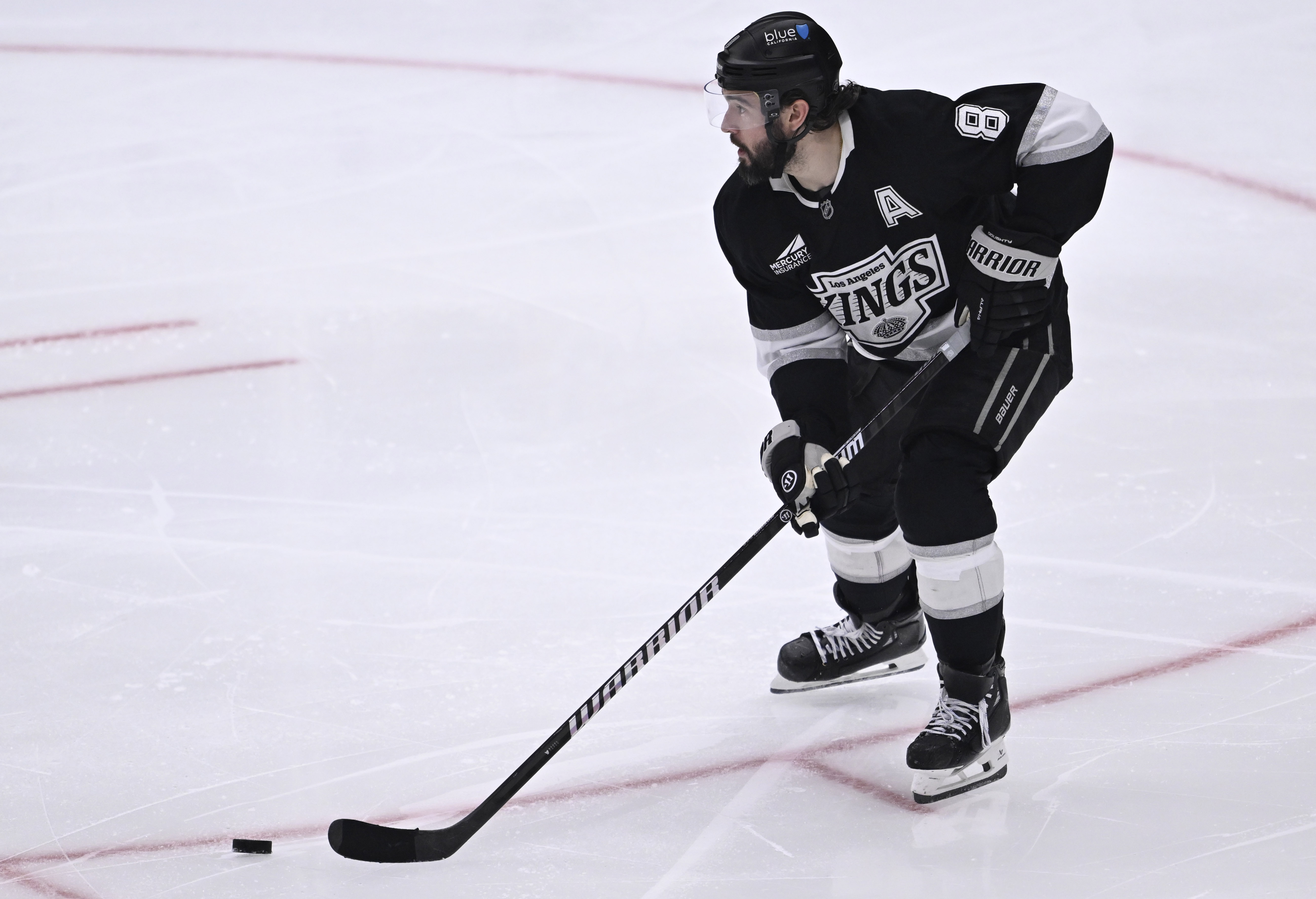 Kings defenseman Drew Doughty controls the puck during the third...