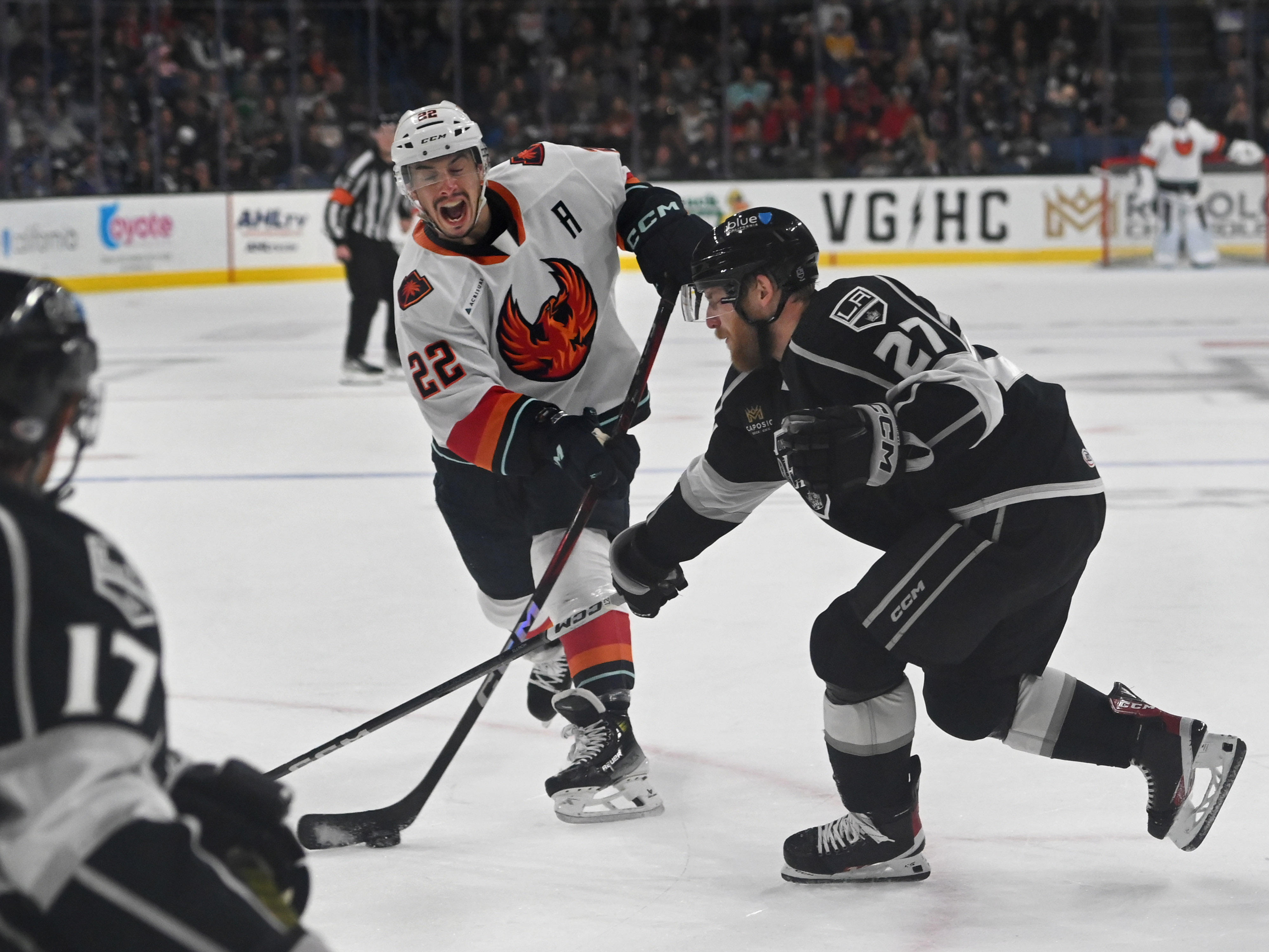 Coachella Valley Firebirds’ Andrew Poturalski and Ontario Reign’s Joe Hicketts...