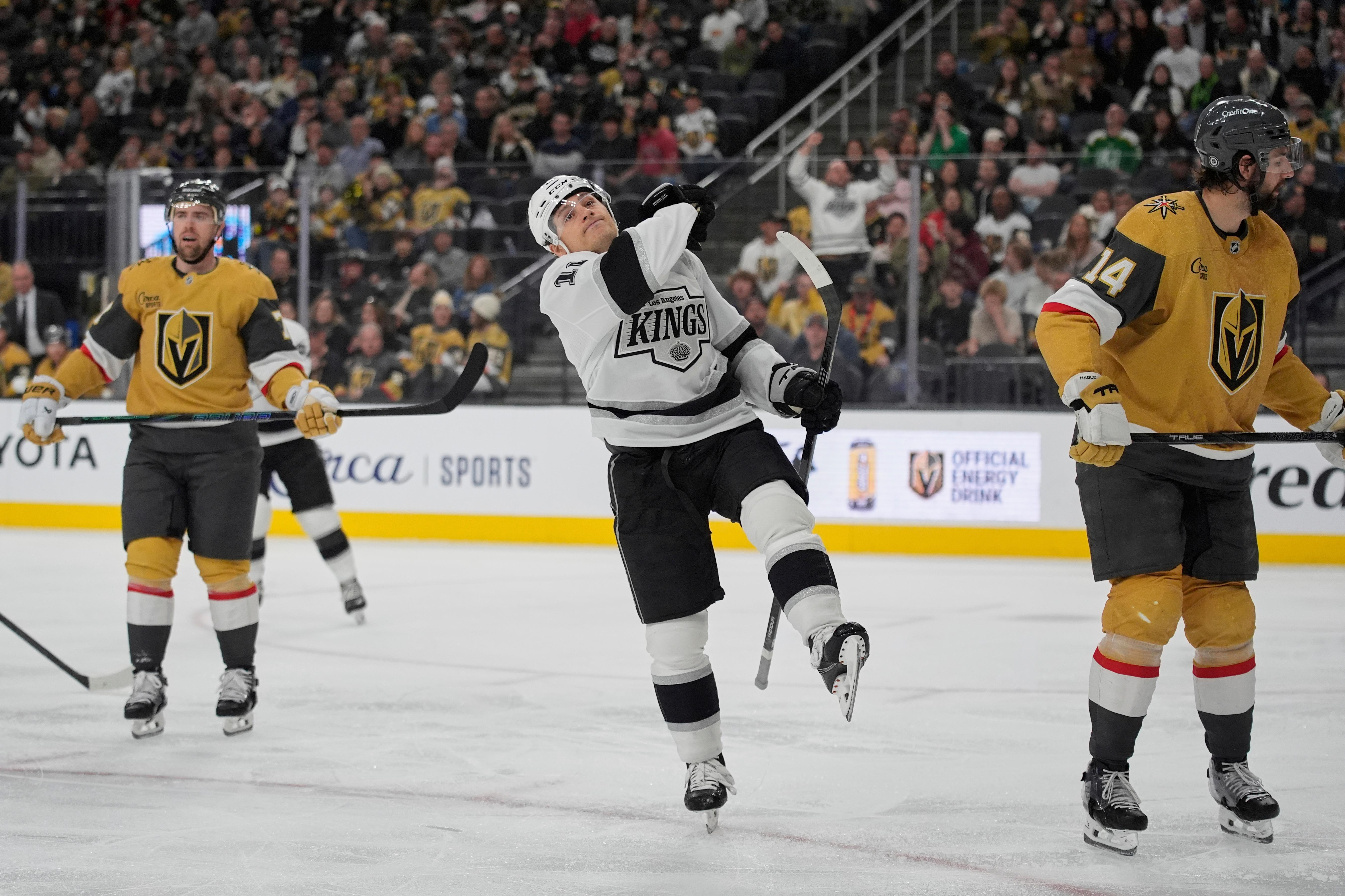 Kings left wing Trevor Moore (12) celebrates after scoring against...