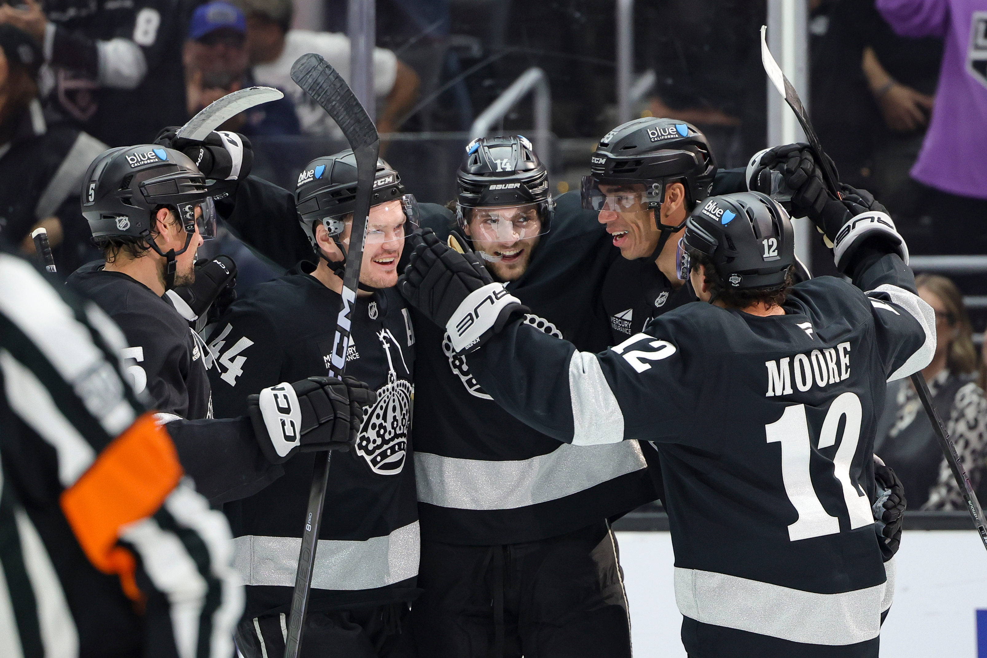 Kings right wing Alex Laferriere, center, celebrates with defenseman Cody...