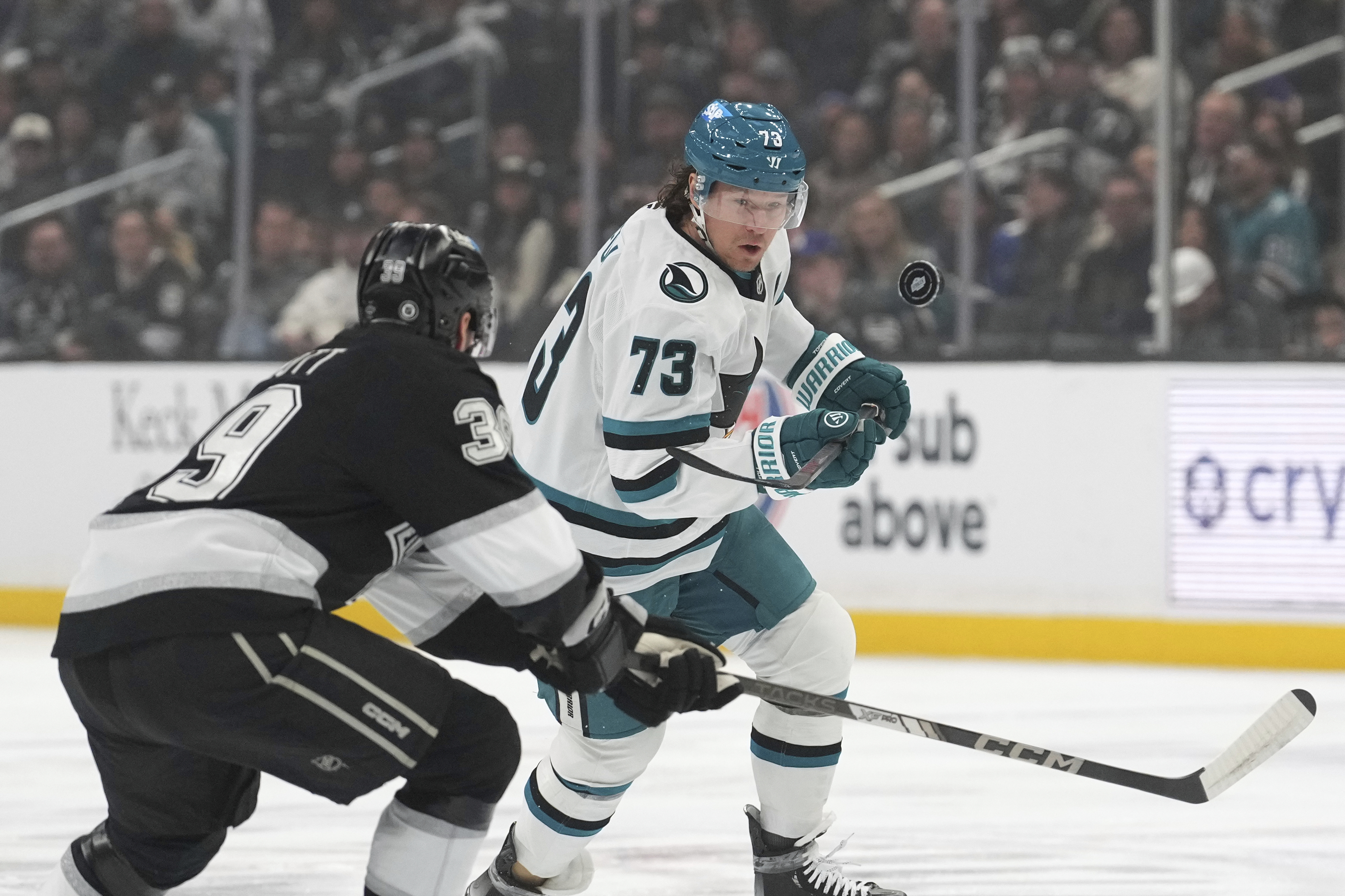 Kings left wing Jeff Malott, left, and San Jose Sharks...