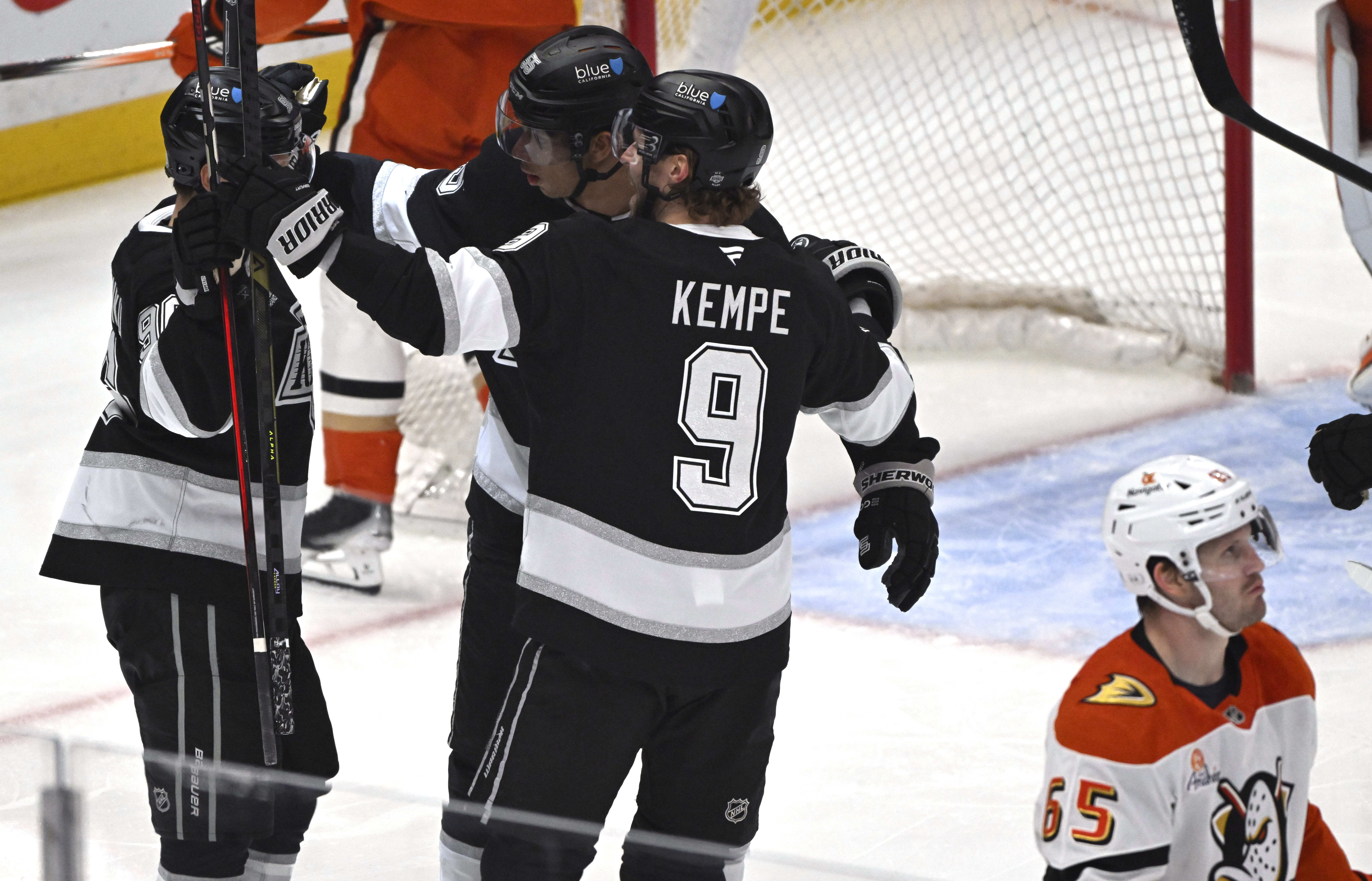 The Kings’ Quinton Byfield (55) celebrates with teammates after scoring...