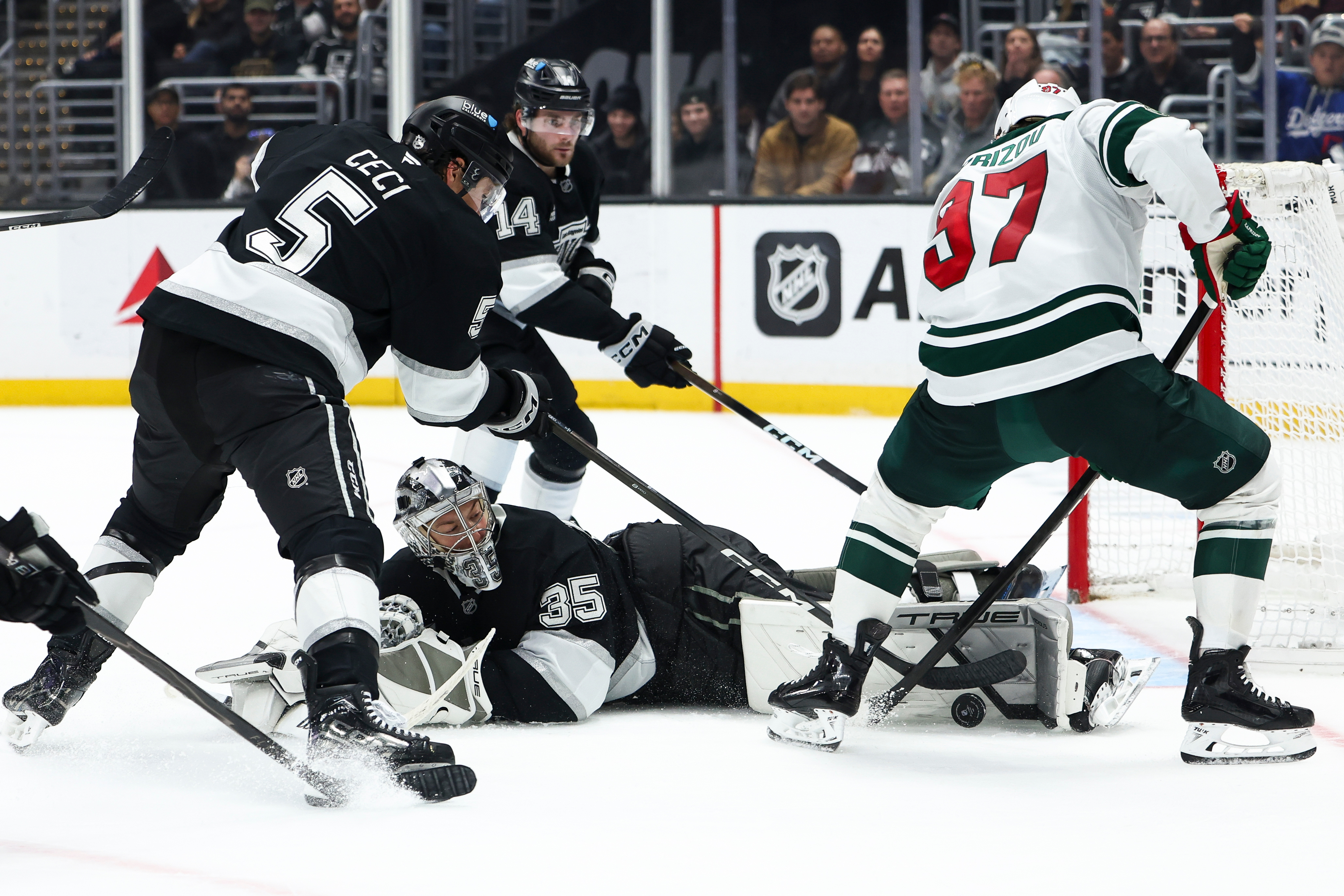 Kings goaltender Darcy Kuemper (35) makes a save against Minnesota...