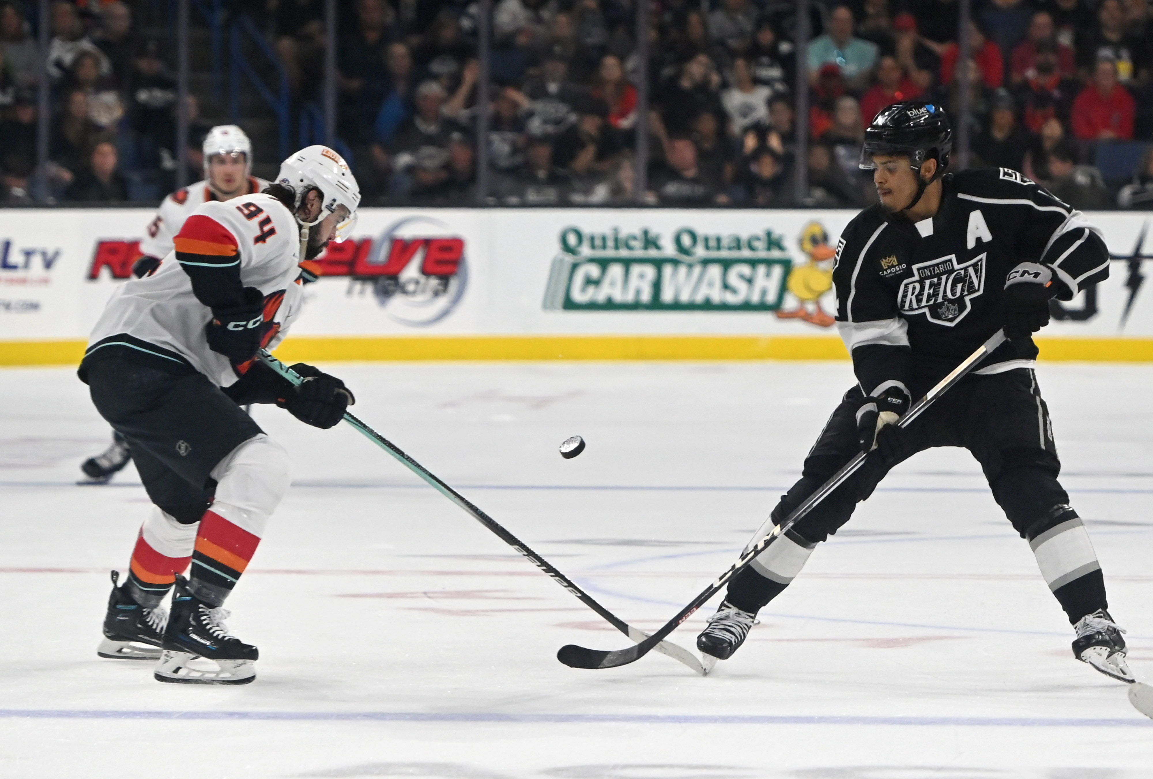 Coachella Valley Firebirds’ Devin Shore and Ontario Reign’s Akil Thomas...