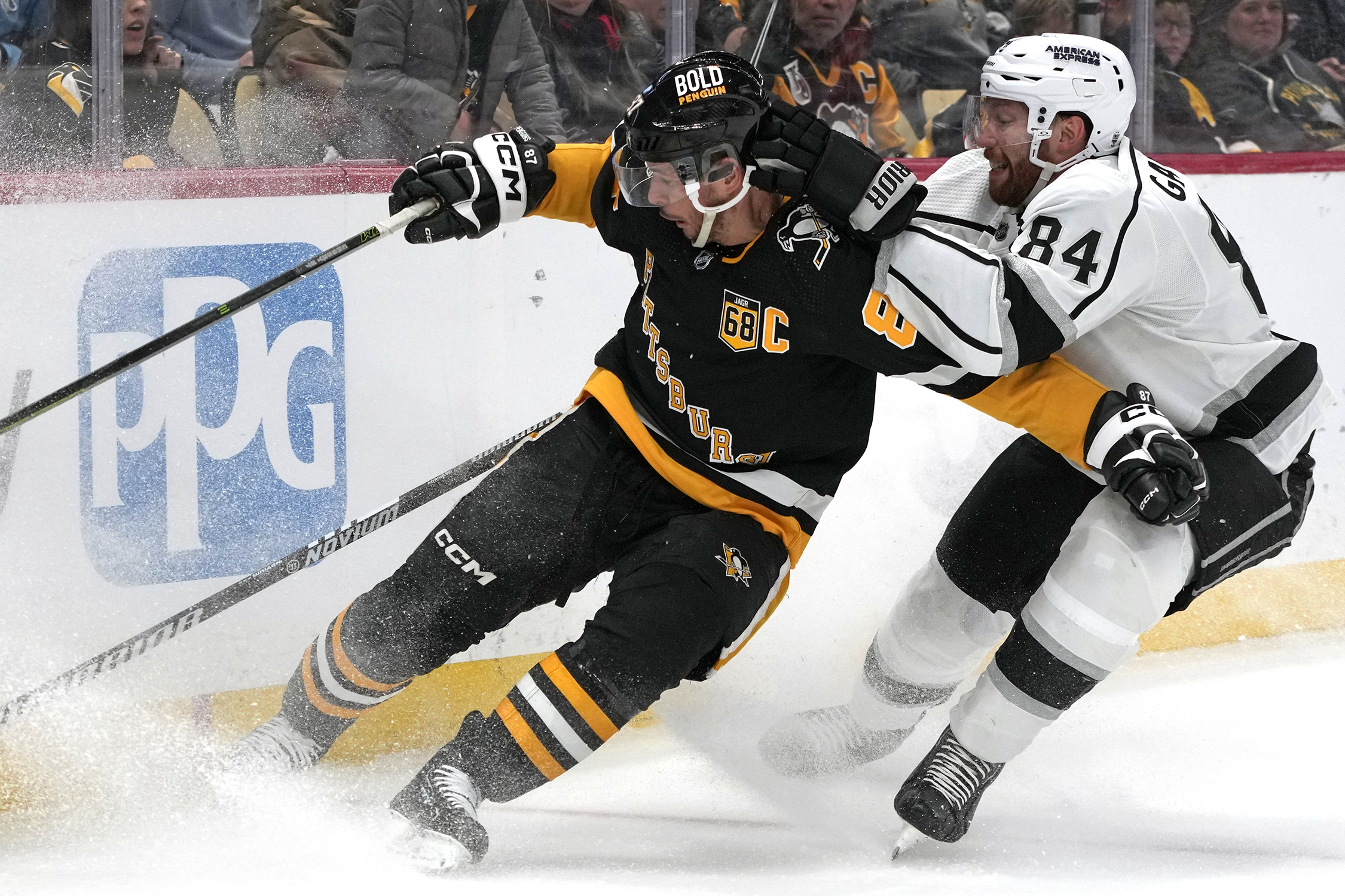 Los Angeles Kings’ Vladislav Gavrikov (84) checks Pittsburgh Penguins’ Sidney...