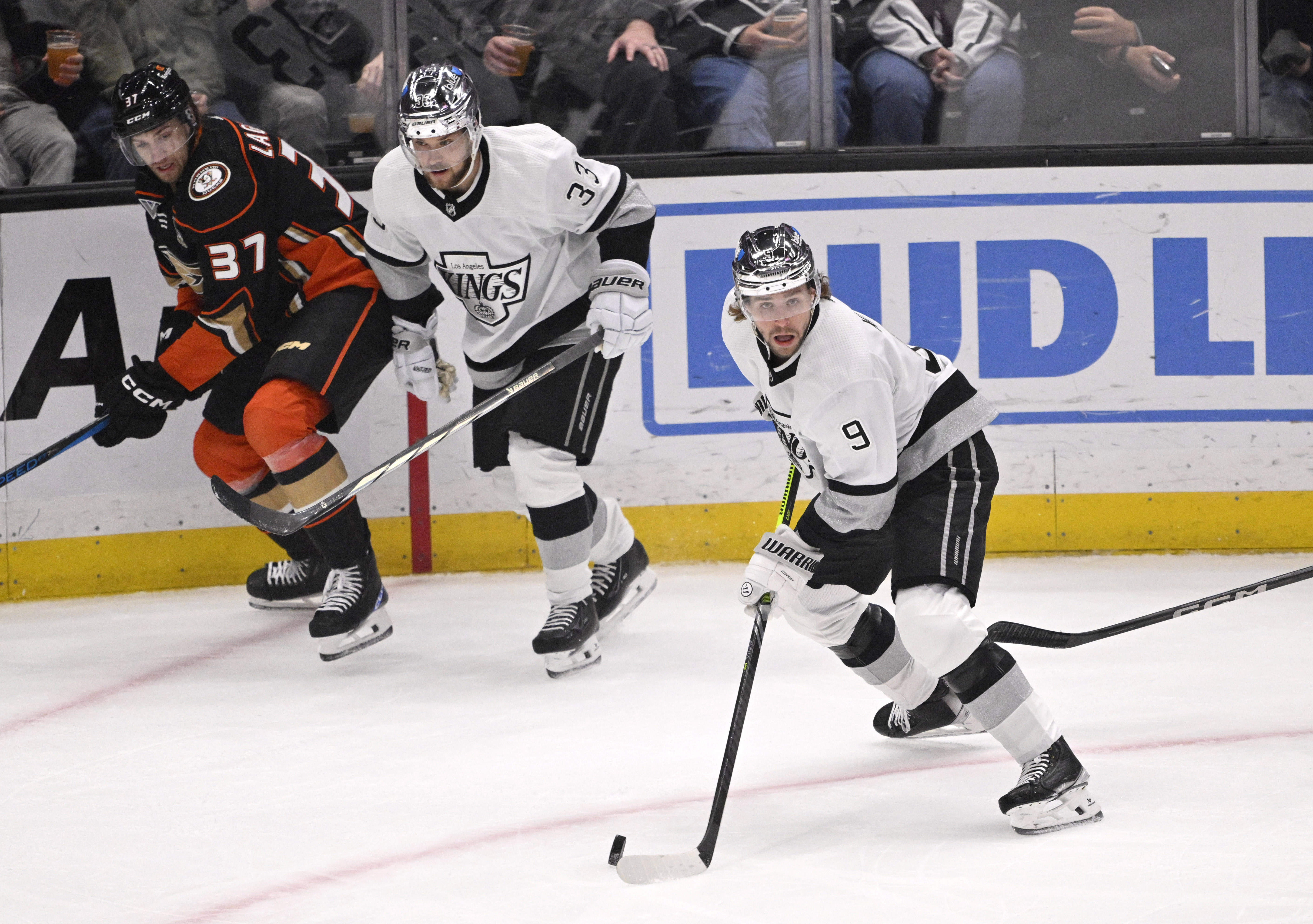 Adrian Kempe #9 of the Los Angeles Kings controls the...