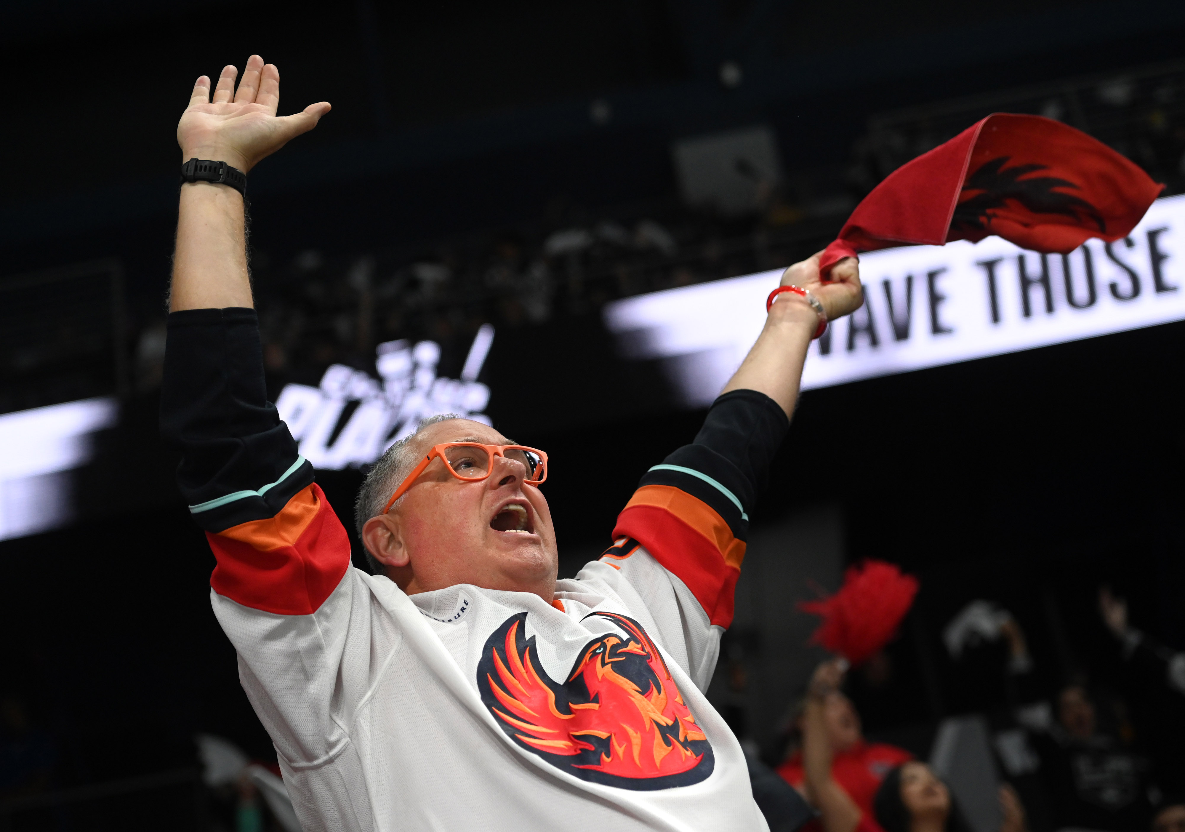 A Coachella Valley Firebirds fan cheers during Game 3 of...
