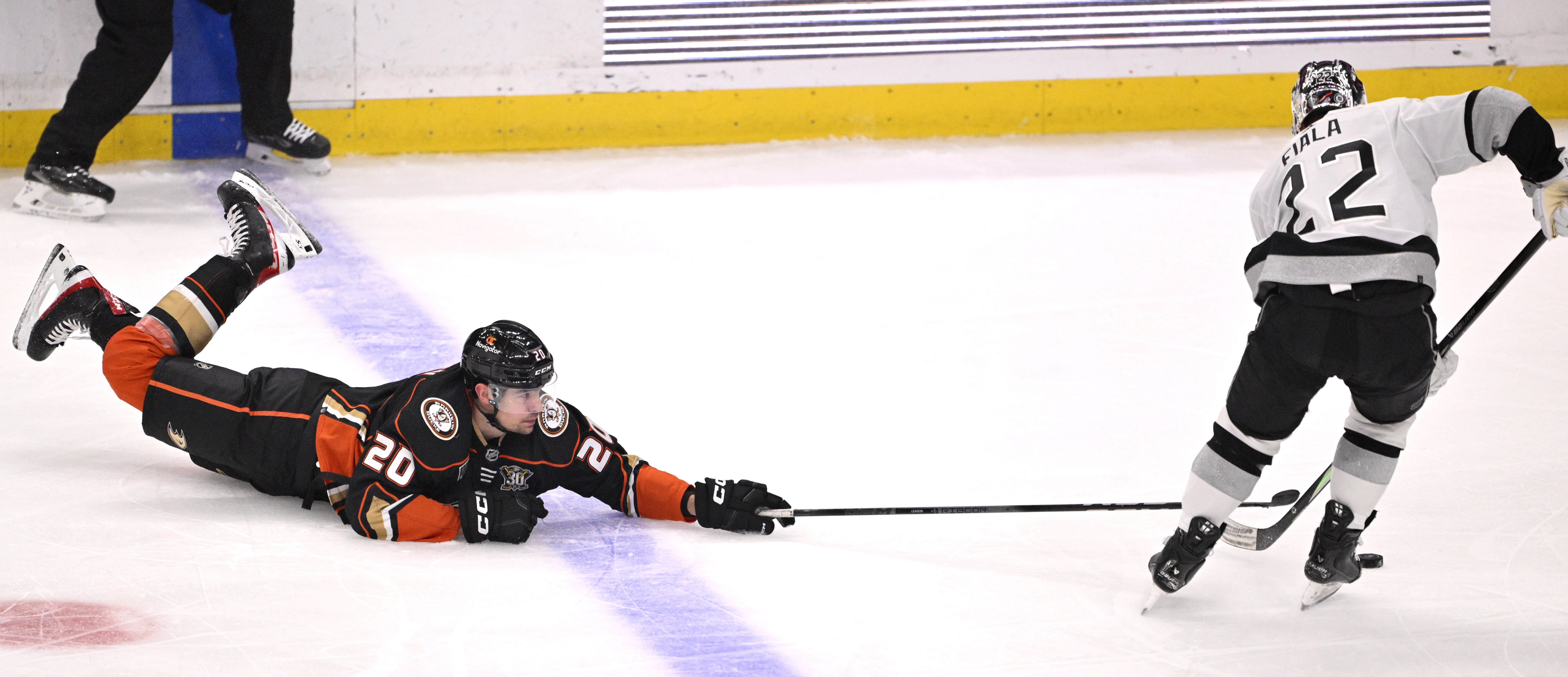 Brett Leason #20 of the Anaheim Ducks reaches for the...
