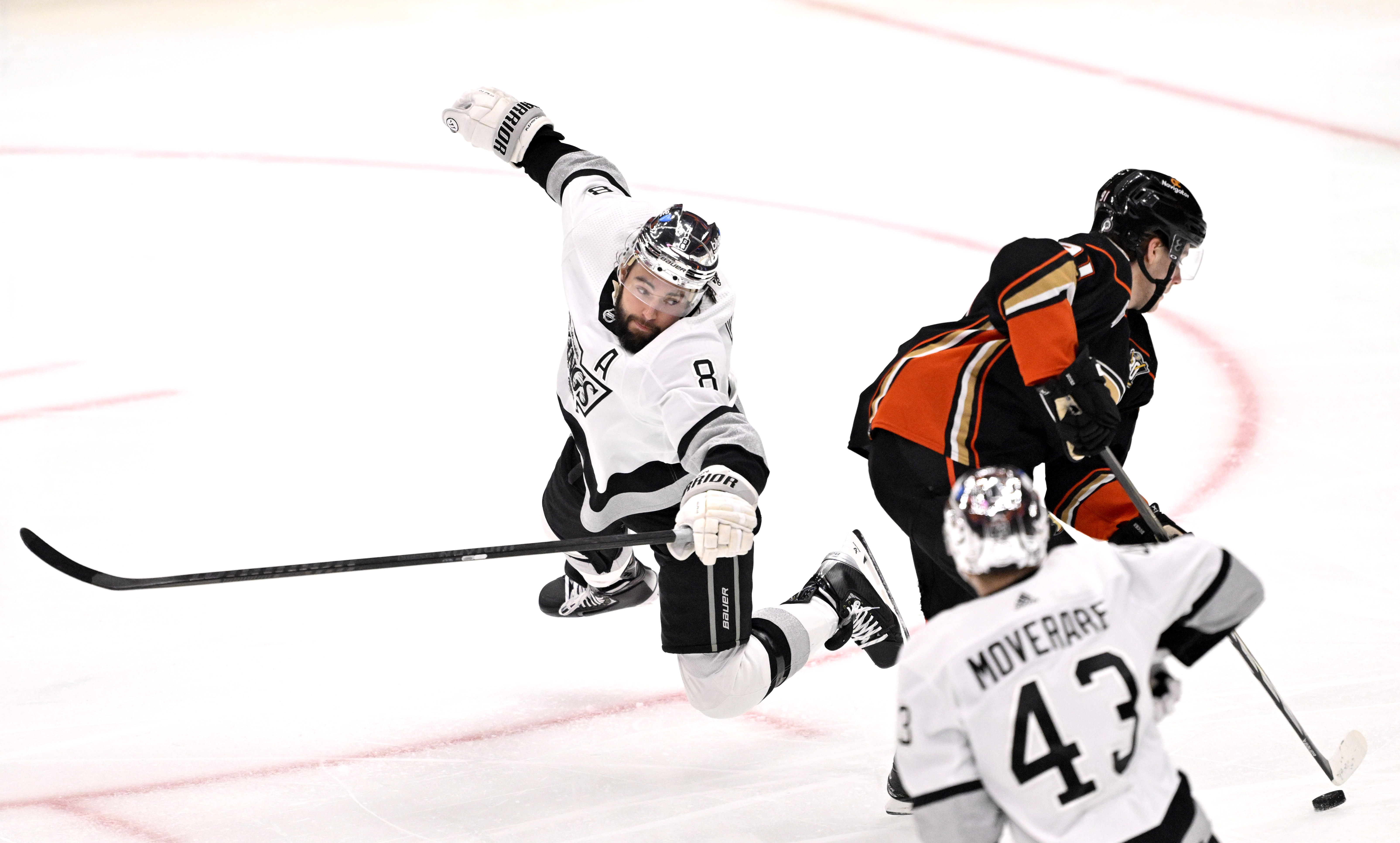 Leo Carlsson #91 of the Anaheim Ducks controls the puck...