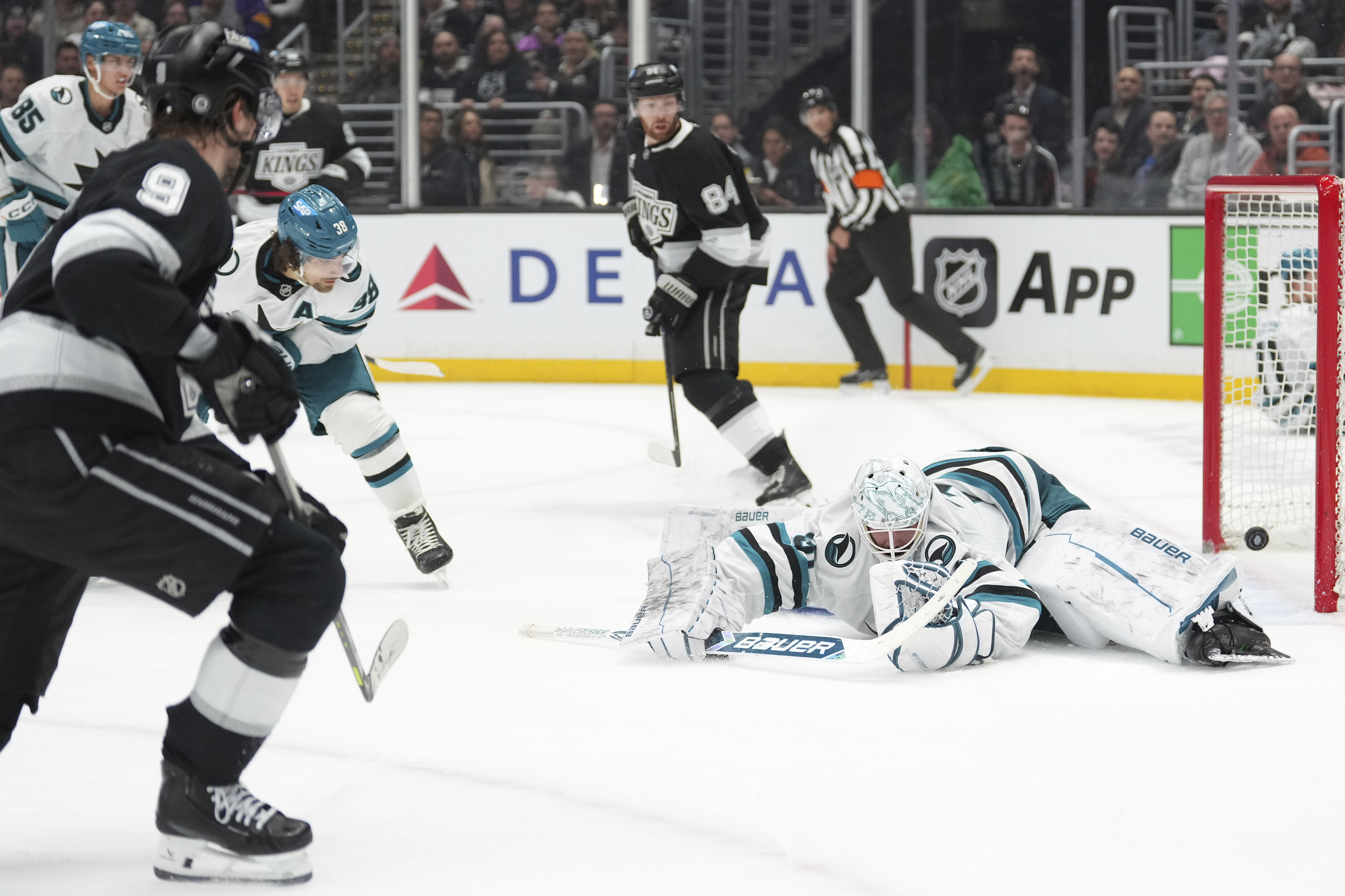 San Jose Sharks goaltender Georgi Romanov is scored on by...