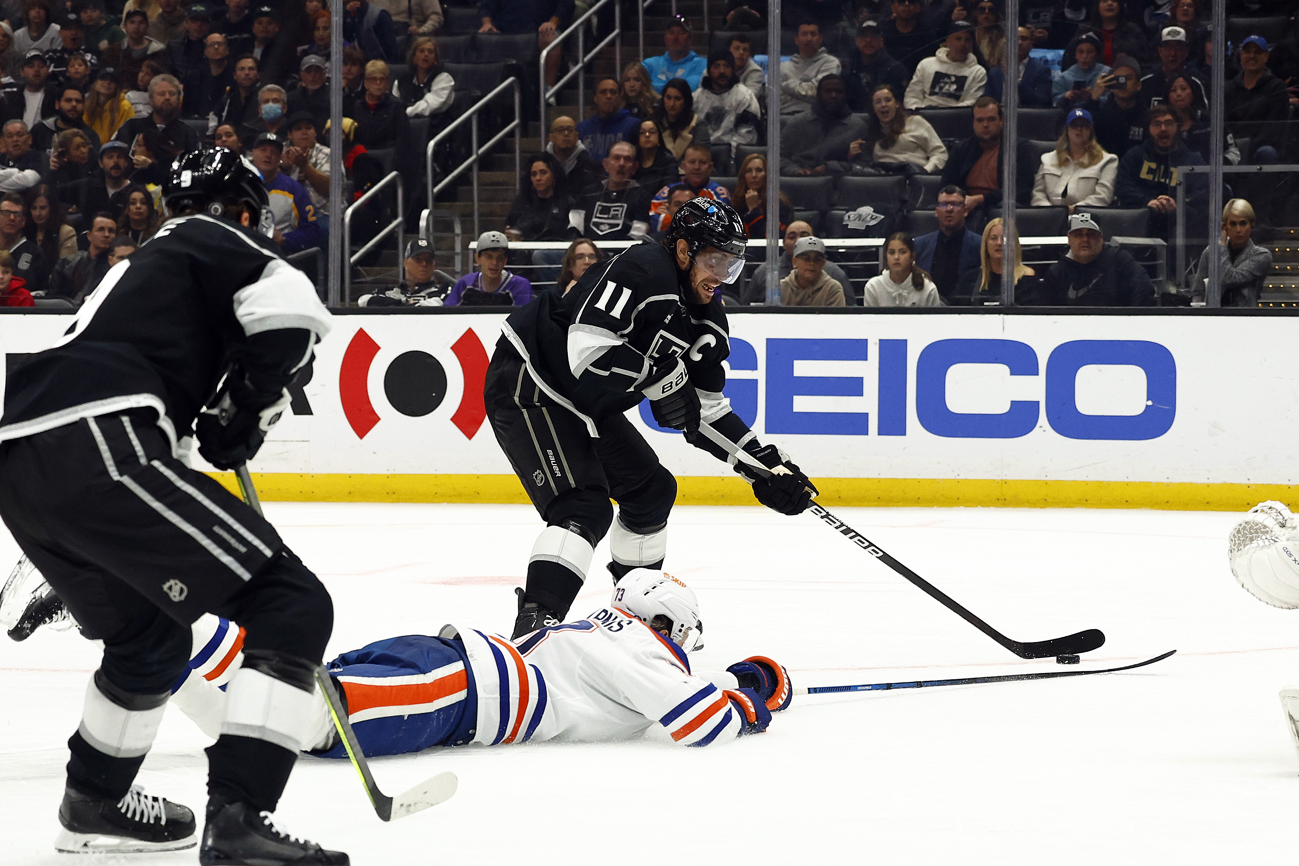 Anze Kopitar #11 of the Los Angeles Kings skates the...